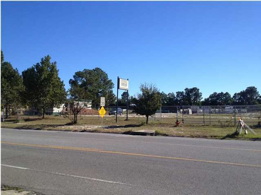 Great storage yard, drop lot etc. The entire parcel is fenced in and the majority of the lot has a base of crushed rock for parking, storage etc. The front of the lot has a concrete parking lot. Water, sewer, and electric are on the property for easy hook up to a modular type building/office.