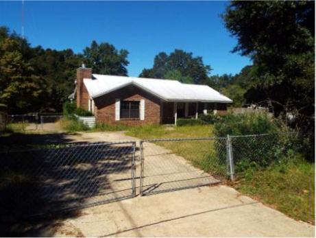 A wonderful all brick home with 3 bedrooms and 2 baths. There is tile throughout and a fireplace in roomy living room for cozy winter evenings. A formal dining room and a large eat in kitchen complete the homes main living area. There is a single attached garage with side entry a covered front porch and a large covered/screened porch in rear with great view of the large yard. All just waiting for new owner!This property is bank owned. It is sold in as-is condition without repairs or warranty. Buyer isresponsible for verifying all information contained in this listing.