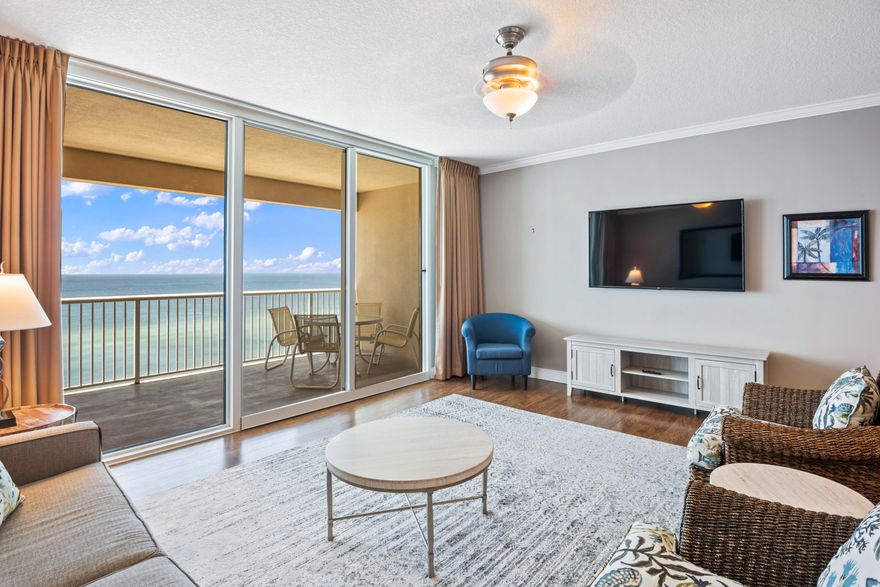 Incredible opportunity to own a fully furnished Gulf front condo on the desirable west end of Panama City Beach! With 4 floors of underground garage, this unit offers 9th floor elevation with amazing panoramic views of the Emerald Coast. This unit boasts an expansive open floor plan totaling 1,026 sq ft offering 1 bedroom, 2 bathrooms & a nice size bunk room. Crown molding & luxury vinyl plank flooring are beautiful features for the main living area & master. The kitchen features new stainless steel appliances, Quartz countertops & breakfast bar, tile backsplash, and plenty of storage with ample cabinets & pantry. The floor to ceiling sliding glass doors & windows enhance the Gulf views even more. Access a spacious 170 sq ft balcony from the living area, the perfect place to relax & dine.