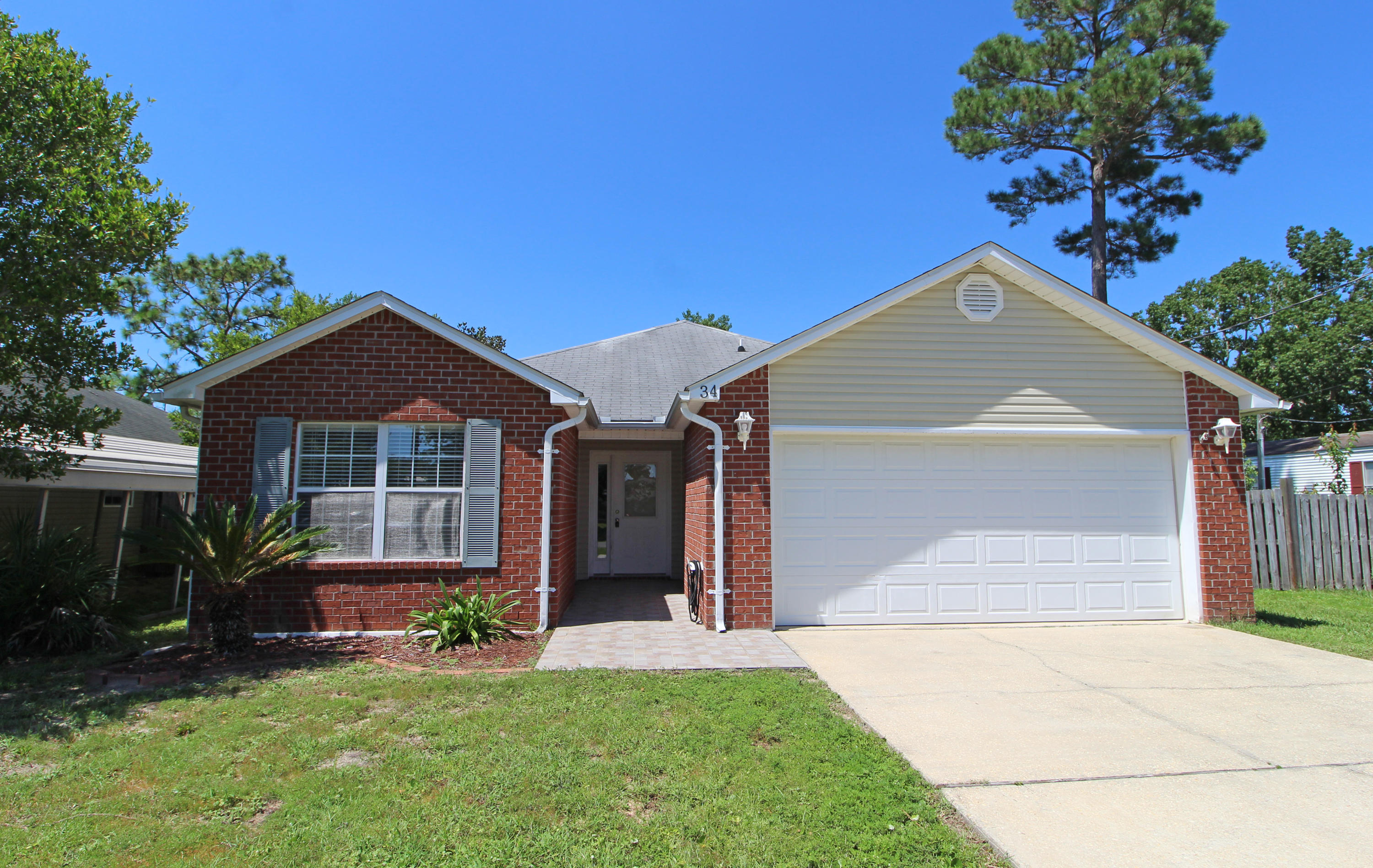 MOVE-IN READY! CHARMING HOME ON A QUIET STREET JUST MINUTES FROM HURLBURT! Tiled foyer leads into a spacious living room with tray ceiling. Dining area is open to the kitchen making entertaining a breeze. Kitchen has plenty of counter space and lots of cabinets, breakfast bar, and appliances to include a smooth top stove. Large master bedroom features tray ceiling and walk-in closet. Master bath has double vanities. Split bedroom floor plan allows you plenty of privacy from guests and children. Two roomy additional bedrooms and hall bath. Backyard features include a nice fenced area for pets. Plenty of room on the side of the home and a double gate, so bring your boat! This home won't last long, so call today!