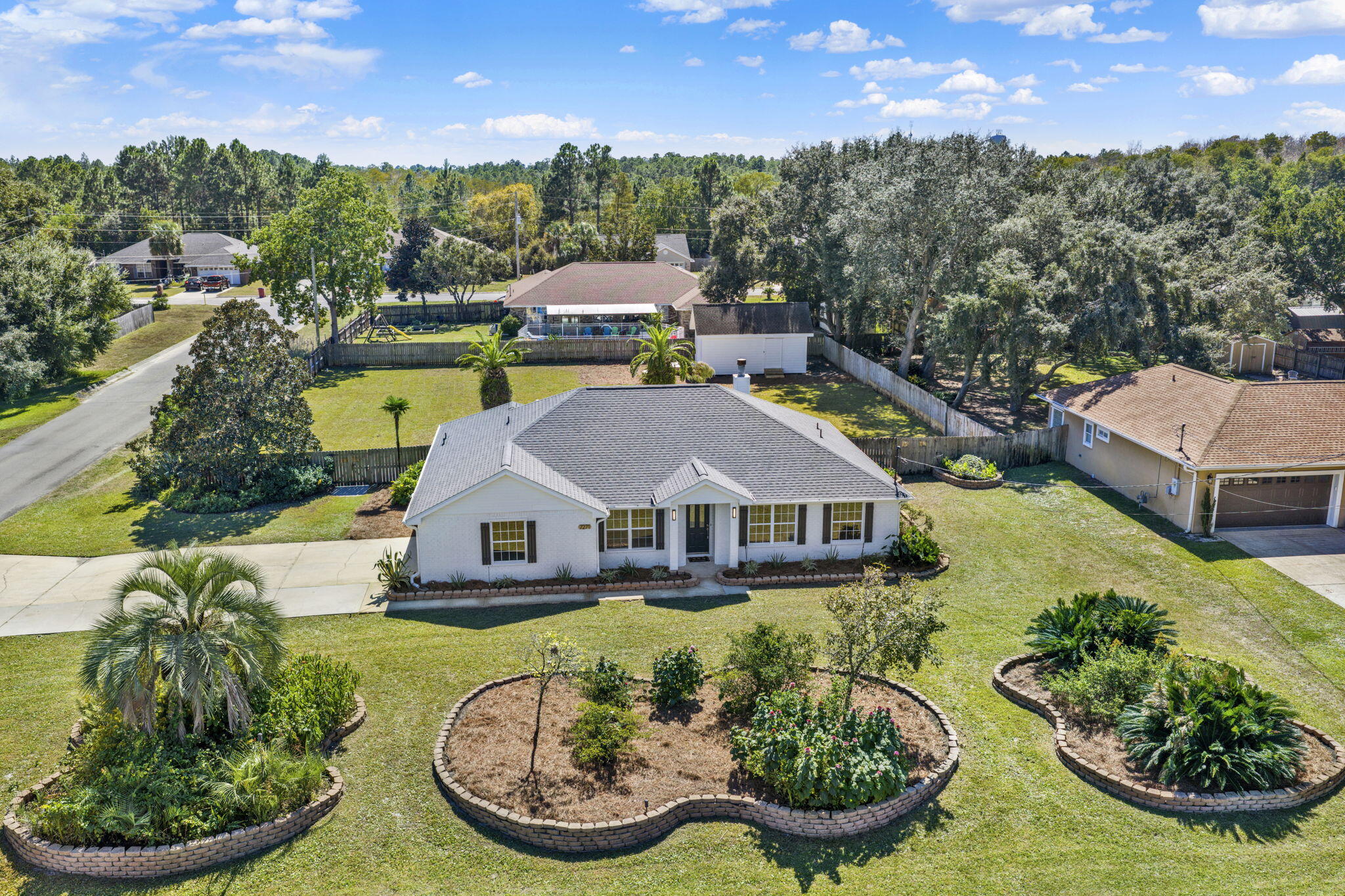 New, New, and More New! This renovated corner-lot home in Holley by the Sea is fully updated and move-in ready. Highlights include a brand-new roof, new kitchen with quartz countertops, new cabinets, appliances, fixtures, and lighting. HVAC (2023). New window glass, plumbing fixtures, LVP flooring, and carpeted bedrooms. Fresh paint inside & out extends to the 14'x24' backyard shop. The large backyard with new sod has room for a pool, garden, or play area. Enjoy Holley by the Sea's 48 acres of amenities--3 pools, gym, tennis & basketball courts, baseball fields, boat ramp & MUCH MORE. Just minutes from Navarre Beach, Pensacola Beach, and nearby bases. Open House: Saturday 10/18, 11 AM-2 PM.