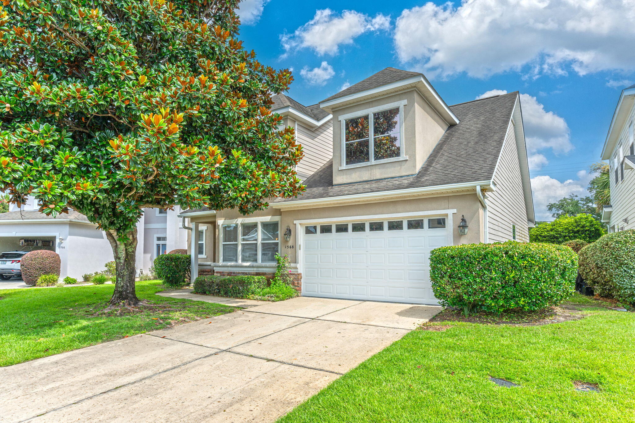High drama! Ten foot ceilings welcome the sunlight into this home in desirable Newport subdivision in the middle of Fort Walton Beach. There's a separate dining room plus a bright breakfast room near the kitchen. The primary bedroom is downstairs, featuring a large en suite with jetted tub and separate shower. The guest bedrooms have their own closets and vanity then share the Jack and Jill water closet and shower. No popcorn ceilings, no 6 panel doors, and the HOA mows your lawn! There's a remarkable amount of storage in this house, even more in the big garage. The screened-in patio will be fantastic for your morning coffee this fall! New paint throughout, new carpet in the bedrooms, and a professional cleaning equate to a seamless move-in experience for you. Pressure washed after pix