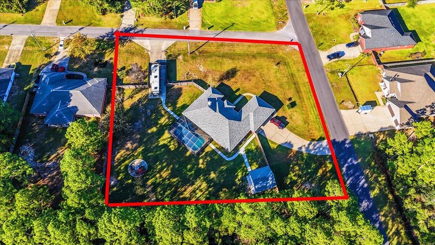 Welcome to your dream home! This meticulously maintained property boasts a host of upgrades and features designed for luxury living and peace of mind. For your comfort and safety, NEW HVAC was installed in JAN 2025, ducting has been cleaned, and an ultraviolet light was added in 2024.The roof was replaced in 2015 and features a 100% peel-and-stick barrier, backed by an Owens Corning lifetime warranty, ensuring durability and protection. Safety anchor points are installed for added security, along with hurricane shutters and fabric coverings for all windows and doors. The expansive, oversized three-car garage provides ample space for a large pickup, while the upgraded gutters and high-volume drainage systems direct water into French drains, safeguarding your property from flooding. Enjoy automatic exterior soffit lighting and a stunning inground pool surrounded by a fully screened lanaiperfect for entertaining or relaxing. The pool features a gas heater installed in 2021, a new liner from 2019, and a pump and sand filter from 2016, with all lanai screens replaced in 2023. This home is equipped with a Generac 20KW gas-powered whole-home generator, installed and maintained by Forest Jordan Associates, ensuring you're never left in the dark. A brand-new 20x20x10 workshop sits on a raised pad with high-strength concrete sidewalks leading to both the workshop and RV pad, both equipped with 50 amp service. The workshop also features 100 amp service and is insulated with air conditioning and an extra-wide industrial roll-up door.  The security system remains with the home, featuring sensors on all windows and doors, along with nine cameras for complete surveillance. Control access to the front door and garage remotely for added convenience. Step inside to discover fresh paint throughout, a complete kitchen remodel with under-cabinet and baseboard lighting, new granite countertops accommodating seating for 6-8, a custom bar cabinet with an outlet for a mini-fridge, and new stainless steel appliances, including double ovens (one functioning as an air fryer). The Bose surround sound system conveys, and a cozy wood-burning fireplace adds warmth to the living space. The master bath is a true retreat, featuring an oversized shower with dual showerheads, new sinks, granite countertops, and stylish vanities. Each bedroom is wired for satellite and data, along with the lanai. The property is fully fenced with two double gates for easy access, while a sophisticated sprinkler system maintains the lush 0.92-acre lot. This home is more than just a property; it's a sanctuary equipped with every modern convenience for a luxurious lifestyle.
Local travel times: 25 min to Hurlburt Field, 45 min to Eglin, 45 min to Pensacola Airport. 
Don't miss out on this incredible opportunity!