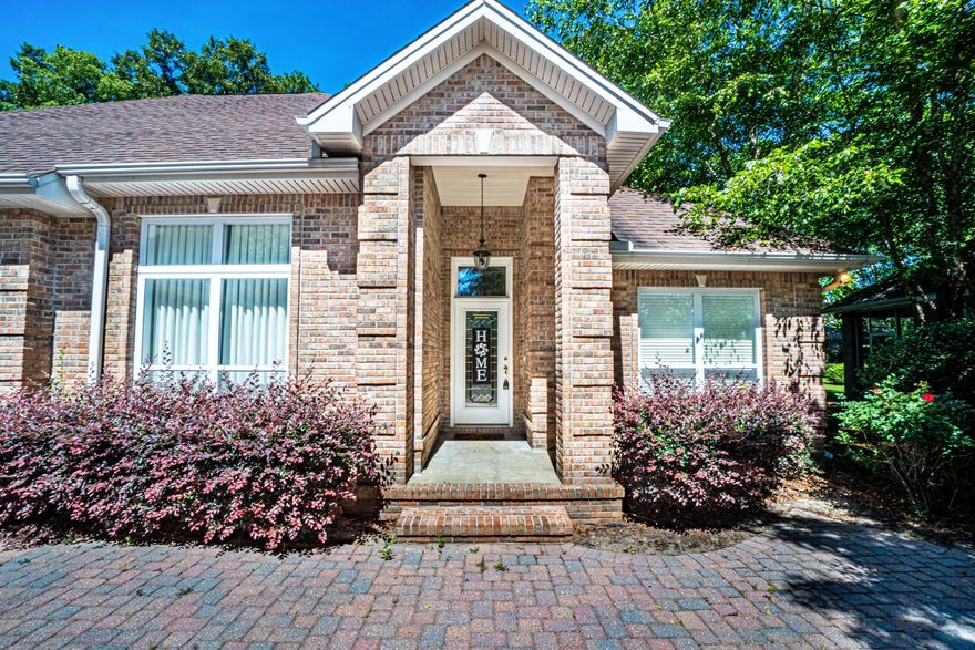 This executive home has over 3,800 sq ft of versatile space, and can be used as a 5 BEDROOM. In the GATED community of Claire's Vineyard, first impressions count: lush landscaping and a brick paver horseshoe driveway lead to a stately pillared entryway and THREE car garage. Throughout the home, take note of details such as recessed lighting, crown molding, and tray ceilings. Upon entering, there are two bedrooms and a full bathroom and an oversized bonus room, currently outfitted as a media space. In the center of the home is a spacious living room with a gas fireplace.