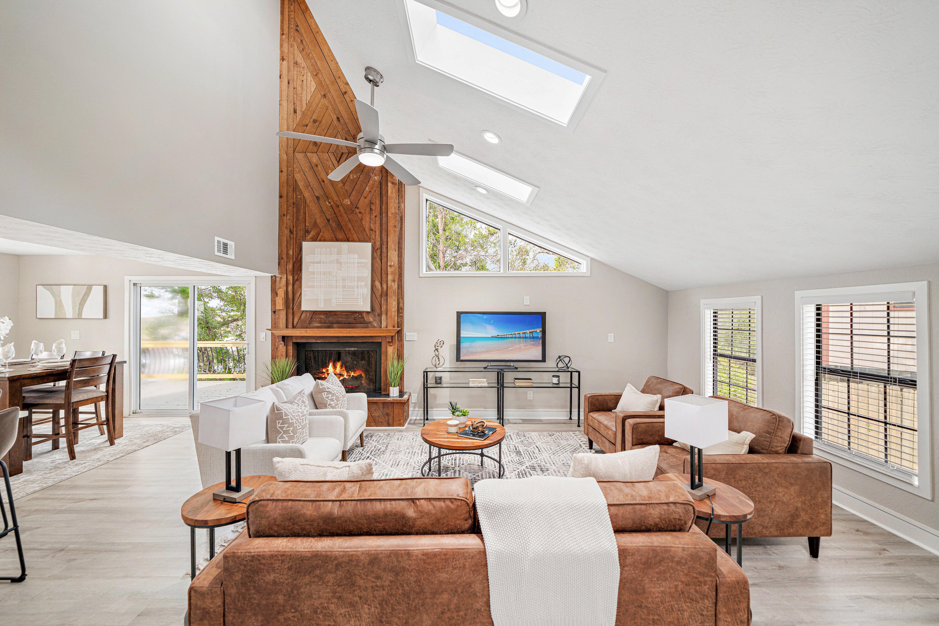 Welcome to 301 Summit Drive, where modern luxury meets unmatched versatility! Perched on the highest point in Destin, this newly renovated three-story home offers a rare combination of primary and secondary living spaces, making it ideal for multi-generational families or a lucrative investment opportunity--all with NO HOA. The first floor features a 900 sq. ft. private unit with a bedroom, fully renovated kitchen, living area, and laundry room. These features allow for the perfect in-law suite, guest quarters, or income-generating rental. This first floor is complete with a separate entrance and access to the main home allowing privacy to potential renters or guests.Upstairs, the second floor boasts an open-concept layout complete with a spacious living room, beautiful vaulted ceilings, a cozy fireplace for chilly evenings, and new skylights that flood the space with natural light and exuberance. The kitchen is a chef's dream, showcasing luxury quartz countertops, brand-new stainless steel appliances, a cozy breakfast bar, and patio doors that open to a new large deck ideal for entertaining both guests and family members. The expansive master suite is conveniently located off the spacious living room and includes an en-suite bathroom complete with a double vanity, shower/tub combo, and custom walk-in closet designed by The Tailored Closet of the Emerald Coast. PLUS, there is a bonus room perfect for an office, play area, reading nook, or Florida room!
The third floor offers two additional guest bedrooms and a full bathroom, with the left bedroom featuring a private balcony perfect for enjoying a morning coffee, a beautiful Destin sunset, or watching the fireworks over the harbor during holidays.
This home is located just steps away from the famous Destin Harbor, you'll enjoy the walking distance to restaurants, bars, shopping, boating, and vibrant nightlife. This home has been meticulously renovated from top to bottom, including a new roof, AC, water heater, two full kitchens, bathrooms, decks, and a stunning brick paver driveway - allowing for plenty of room for parking!
