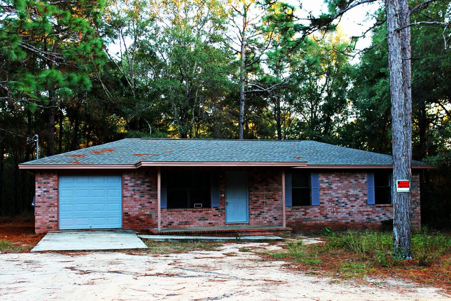 All brick home with 1 car garage located on 1.24 acres. Perfect home for first time home buyer's or great rental property. New roof only 1 year old. The seller just updated the kitchen with new paint, counter tops, cabinets and sink. Vinyl flooring through-out house. Kitchen cabinets/drawers and new hot water heater coming soon. Buyer to verify all measurements.