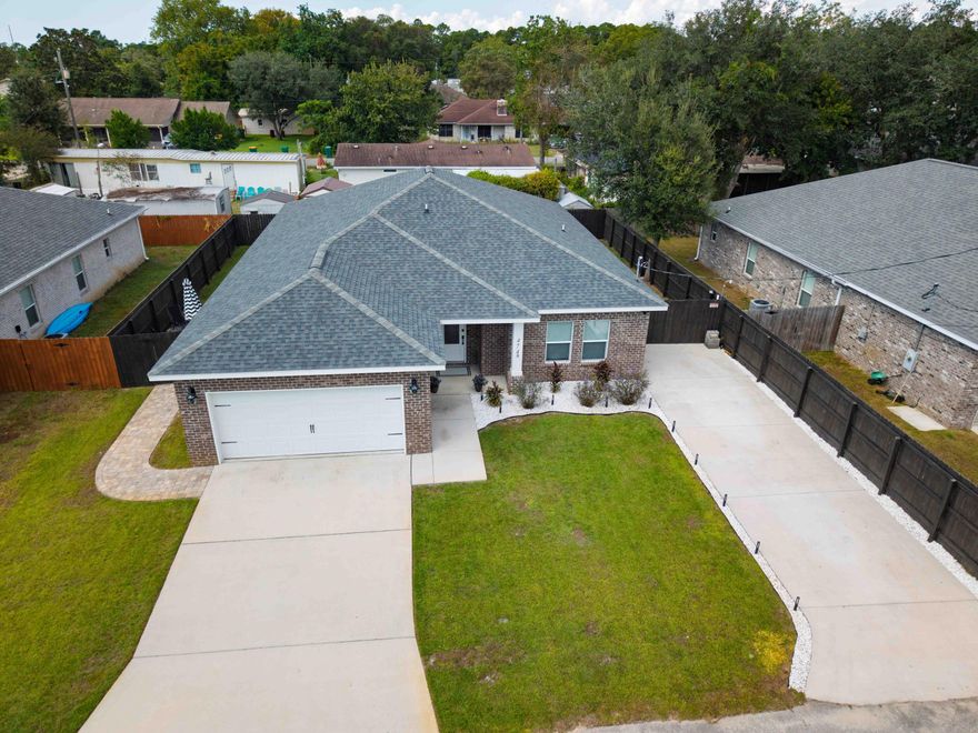 Discover the perfect blend of comfort, style, and location at 474 Sara Avenue in Mary Esther, Florida. This all-brick 3-bedroom, 2-bath home is ideally situated north of the Intracoastal Waterway and just minutes from the sugar-white sand beaches of the Emerald Coast, the popular Navarre Pier, local dining favorites like La Casa Bianca, the Aegean, and the brand-new Publix.Step inside to an inviting open layout highlighted by granite countertops, rich wood cabinetry, and upgraded fixtures throughout. The spacious 18x14 primary suite offers a true retreat, featuring a 16x12 spa-like bathroom with a separate tiled shower and plenty of space for relaxation.Entertain with ease in the main living area that flows seamlessly to the covered, screened-in lanai--perfect for morning coffee, evening cocktails, or weekend BBQs. The fenced backyard includes a lawn pump and sprinkler system, making it easy to maintain a lush outdoor setting. There's even room for a pool (renderings available), offering the opportunity to customize your very own backyard oasis.

Additional features include dimmer switches on all lighting for customizable ambiance and thoughtful upgrades that enhance both style and comfort.

This Mary Esther gem combines classic brick construction, modern finishes, and a highly desirable location just minutes from shopping, dining, and Florida's beautiful Gulf beaches.