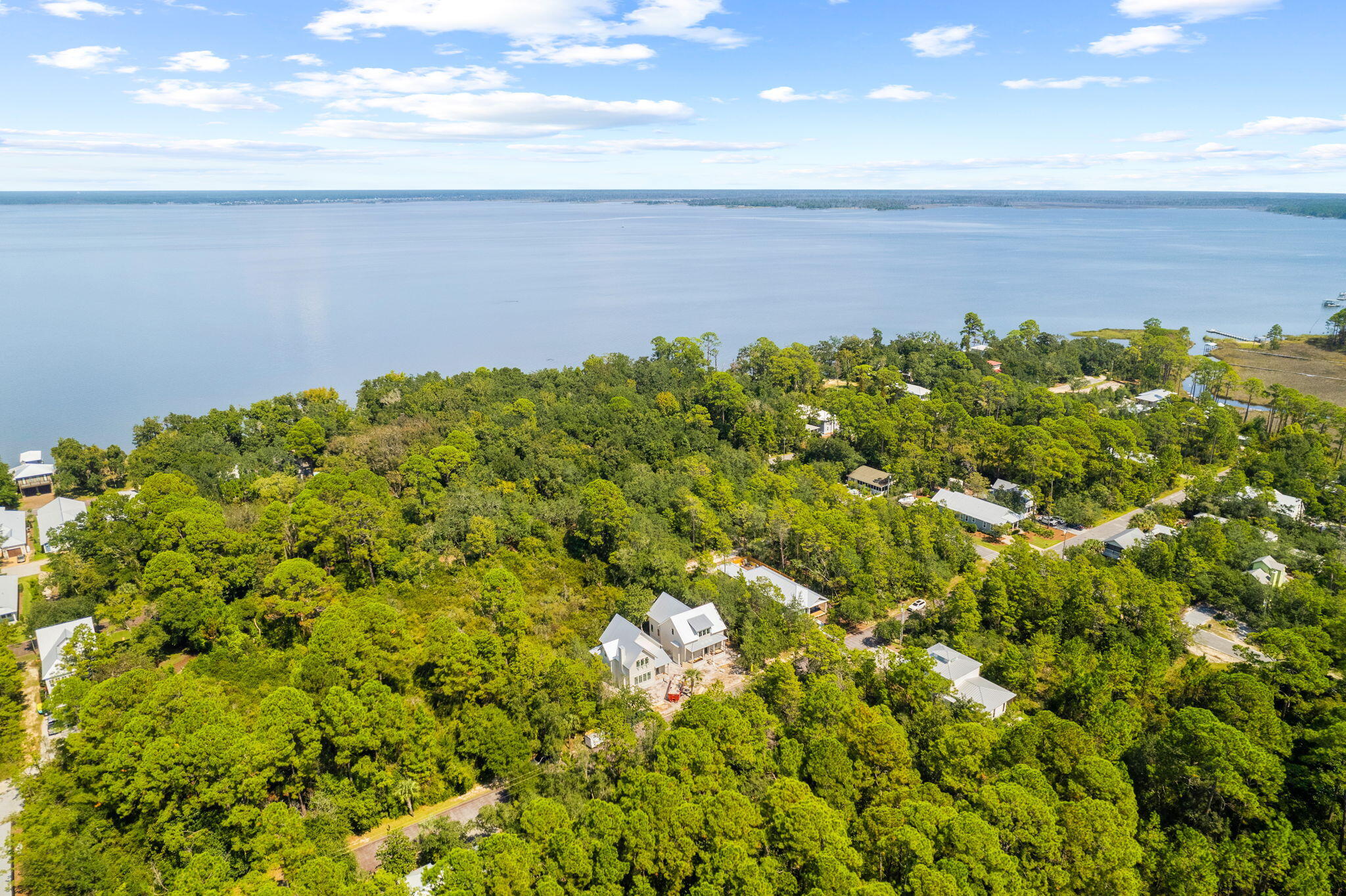 Located on Silverleaf Lane, this lot offers easy access to Bayside Ranchettes Park with shaded parking, picnic tables, a fishing dock, and a kayak/canoe launch. Tom's Marina provides nearby boat slips for quick bay access. Enjoy the outdoors with Grayton Beach State Park just four miles away and bike paths through Point Washington State Forest. Experience the tranquility of this quiet community while being minutes from 30A's shops, restaurants, beaches, and the Gulf.