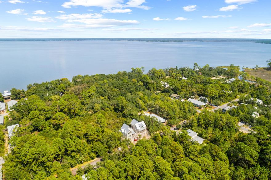 Located on Silverleaf Lane, this lot offers easy access to Bayside Ranchettes Park with shaded parking, picnic tables, a fishing dock, and a kayak/canoe launch. Tom's Marina provides nearby boat slips for quick bay access. Enjoy the outdoors with Grayton Beach State Park just four miles away and bike paths through Point Washington State Forest. Experience the tranquility of this quiet community while being minutes from 30A's shops, restaurants, beaches, and the Gulf.