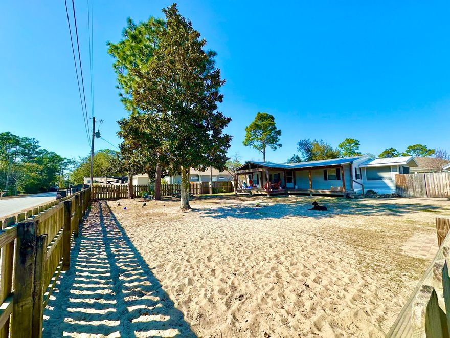 Set in a highly desirable, fast-growing neighborhood surrounded by attractive new construction, this property offers both comfort and long-term value in a well-connected area with convenient access to beaches, 30A, schools, shopping, dining, and everyday amenities. With 1,215 square feet of updated living space this 3 bedroom, 2 bath manufactured home sit on a spacious 0.27 acre lot with fenced front and back yards Built in 2002 with the addition of a sizable covered front porch creates a comfortable outdoor gathering space. The metal roof is approx. 10 years, and AC replaced about 6 years ago. Remodeled kitchen and baths elevate the space along with an 800 square foot detached garage/workshop with the additional storage space. Schedule a private showing today!