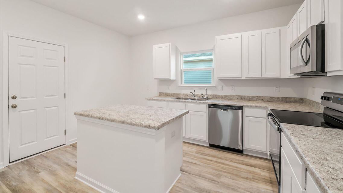 Welcome to your new home in the vibrant sought after area of Owls Head, part of the growing community in Freeport, Florida! This spacious three-bedroom, two-bathroom residence offers ample living space. Enjoy the convenience of a garage and the tranquil setting next to a community lake and park, ideal for outdoor activities and gatherings. Located just off Highway 331, this home is only 20 minutes away from the breathtaking white sandy beaches of the Emerald Coast , with easy access to Scenic Highway 30A and the Bustling Hub of Destin. Experience the perfect blend of comfort, community, and coastal living in this delightful property!