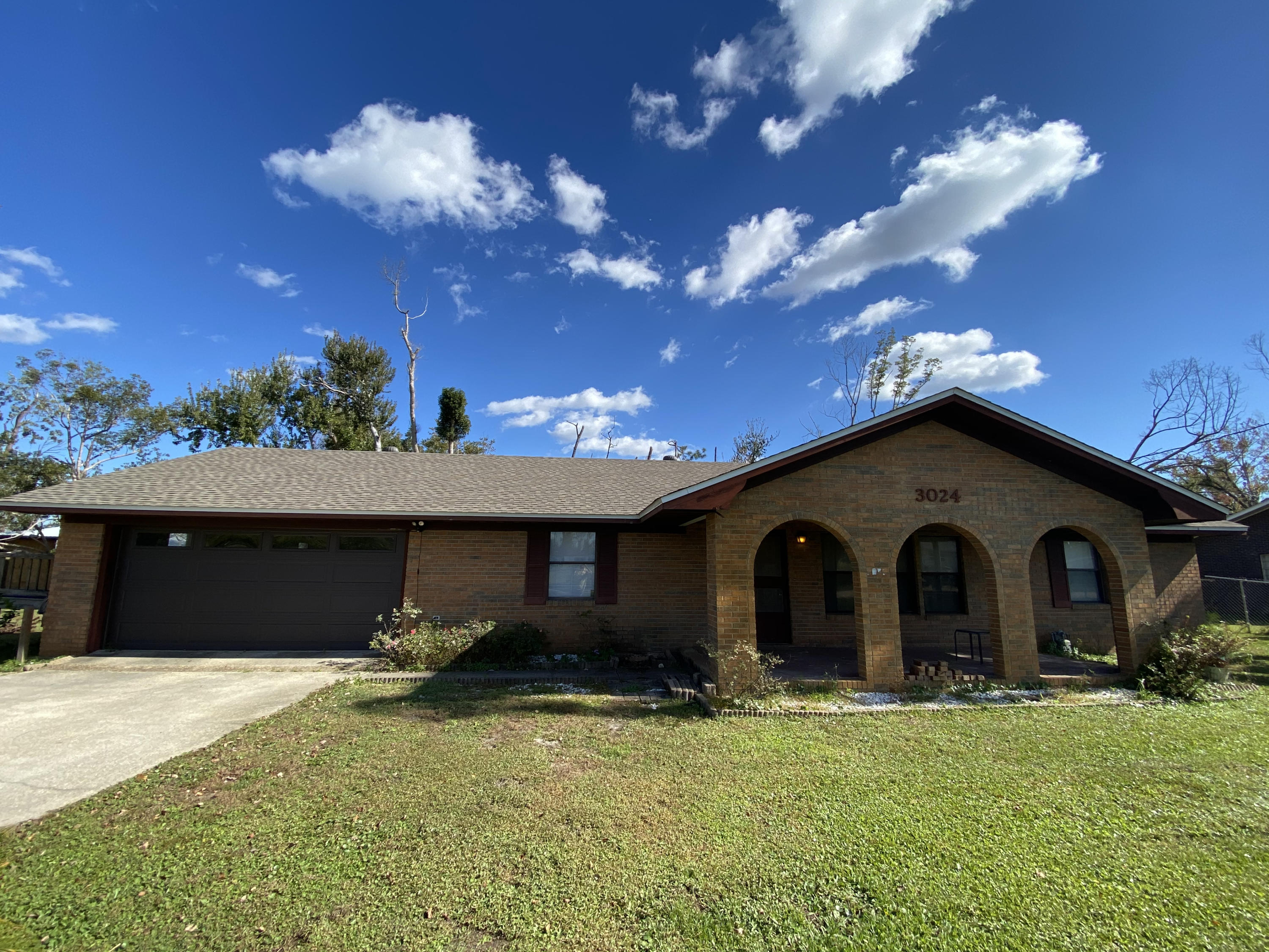 Robust 3 bedroom 2 bath brick home features a gorgeous stone fireplace in the living room and a newly renovated kitchen. Plenty of space with separate dining area and bonus Florida room. Large, private master includes bathroom with double vanity. Two more comfortable bedrooms on the other end of house with another full bathroom. This home sits well on a large end lot measuring over 1/2 acre. The lot also hosts a covered RV carport with water, electric, and septic hook up as well as a sizable workshop with attached mother-in-law suite complete with it's own kitchen and full bathroom! Since 2019, this home has received a new roof, all new kitchen, all new HVAC system, and other improvements. The renovations have began for this feature rich house and is ready to be completed as your new home!