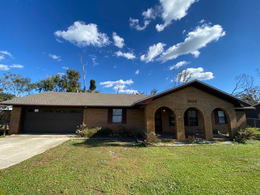 Robust 3 bedroom 2 bath brick home features a gorgeous stone fireplace in the living room and a newly renovated kitchen. Plenty of space with separate dining area and bonus Florida room. Large, private master includes bathroom with double vanity. Two more comfortable bedrooms on the other end of house with another full bathroom. This home sits well on a large end lot measuring over 1/2 acre. The lot also hosts a covered RV carport with water, electric, and septic hook up as well as a sizable workshop with attached mother-in-law suite complete with it's own kitchen and full bathroom! Since 2019, this home has received a new roof, all new kitchen, all new HVAC system, and other improvements. The renovations have began for this feature rich house and is ready to be completed as your new home!