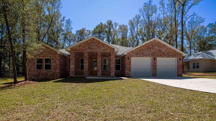 No HOA in this well established neighborhood with blue water Lake Juniper views. This custom new construction brick home is nestled on a large wooded lot at the end of  the cul-de-sac, with all the updated farmhouse style and charm you'd desire. Upon entry, the foyer is styled with a barrel vault pine tongue and groove ceiling, with sconce lighting and columns, perfectly planned to display art or precious family photos. Next, opening up to the great room, you'll find tons of light from the windows framing the sizable back yard, with more tongue and groove ceilings, this time vaulted. Each space is generously sized for comfort. From the well appointed kitchen with raised breakfast bar, gas range, the newest in stainless steel appliances and a double pantry between the kitchen and utility room. The colors and textures blend seamlessly with neutral hues in the durable engineered bamboo flooring, except in tiled wet areas. The dining area comfortably seats 8, taking in the back yard views (or your future pool). A classic and family friendly wet bar is conveniently located adjacent to both the dining and living rooms. Next, the roomy master suite is a true retreat, including striking trey ceiling, complete with ambient lighting. The master bath embodies luxury, with double vanity, quartz counters and no amenity forgotten: soaking tub, fully tiled large walk-in shower, water closet and expansive walk-in closet with custom built-ins. The additional 3 bedrooms are generously sized, as are the additional 2 full bathrooms. Flanking the great room are 2 multi-functional rooms, which would be perfect as his and hers home offices; or could easily serve a multitude of purposes, only limited by your imagination. The attic has foam insulation for superior efficiency. The back yard has plenty of room for a pool and has a naturally wooded border on 2 sides for privacy. If you're looking for top notch construction, all the proverbial bells and whistles, in a fantastic location with lots of space inside and out, this one is not to be missed. *Note: pictures are from a previous build. A few minor things have changed/been improved from the photos.