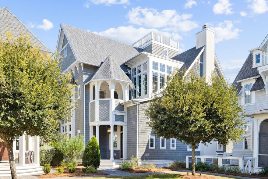 Perfectly positioned along Scenic Highway 30A within the exclusive gates of Grace Point, this architectural masterpiece by R.W. Lowe and Point Construction captures the essence of refined coastal living. Spanning 5,923 square feet, the home offers six bedrooms plus a bunk room, seven full and two half baths, and a seamless flow between indoor and outdoor spaces designed for both relaxation and entertaining. A grand double staircase welcomes you into a sun-filled interior featuring 12-foot ceilings, reclaimed beams, and shiplap accents. The gourmet kitchen, anchored by a 48'' Wolf range and marble finishes, flows seamlessly into the living area with a gas fireplace. Upstairs, each bedroom offers a private ensuite bath, while the third-floor primary suite boasts a steam-equipped dual shower , and private access to the rooftop deck. Six outdoor patios, a private pool, built-in grill, and rooftop terrace with sweeping Gulf vistas create a true coastal retreat. An elevator and two-car garage provide effortless convenience across all three levels. Grace Point is a private, gated enclave where timeless architecture and lush green spaces meet a relaxed beachside rhythm. With direct gated access to the Watersound Beach Clubfeaturing private beach access, pools, cabanas, and diningresidents enjoy a rare blend of tranquility and resort-style luxury. 25 Peace Lane stands as a testament to exceptional craftsmanship and coastal elegancean extraordinary offering along 30A.