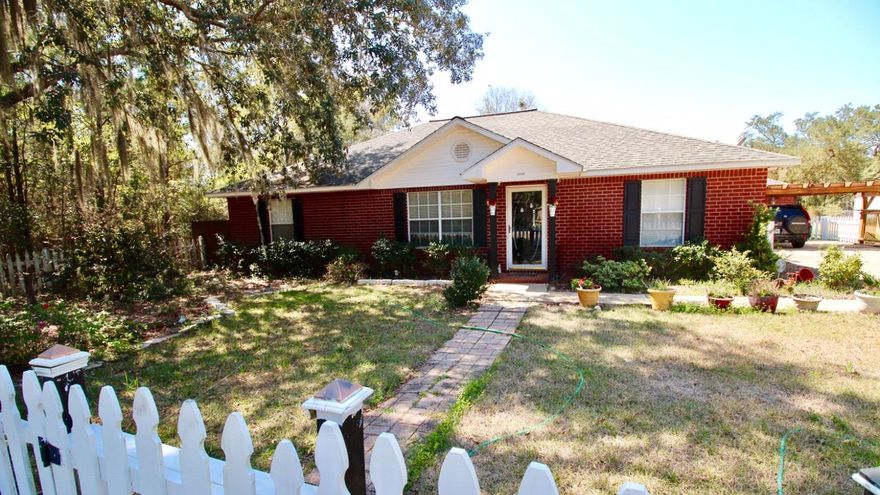 All Brick, Open Floor Plan with Vaulted Ceilings, Split Bedrooms, and Screened Porch.The tiled Breakfast nook overlooks the back yard. A large bar separates the Kitchen and Dining Room areas. ALL Stainless Steel Appliances in the Kitchen CONVEY.Laundry Room has movable shelves behind the door, storage cabinets above the washer and dryer. Washer and Dryer CONVEY.Fenced Corner Lot, Boat Ramp Near by With Picnic Tables, Room for your RV and BOAT STORAGE.Detached oversized garage with shelving. Lighted, shaded Pergola driveway parking. New irrigation pump, sprinkler system, automatic timer with controls in the garage. Shed just inside the double gates to the rear of the lot.TERMITE BOND & Metal Hurricane Shutters CONVEY. No HOA or Flood Ins required. Roof is 35 yr architectural.