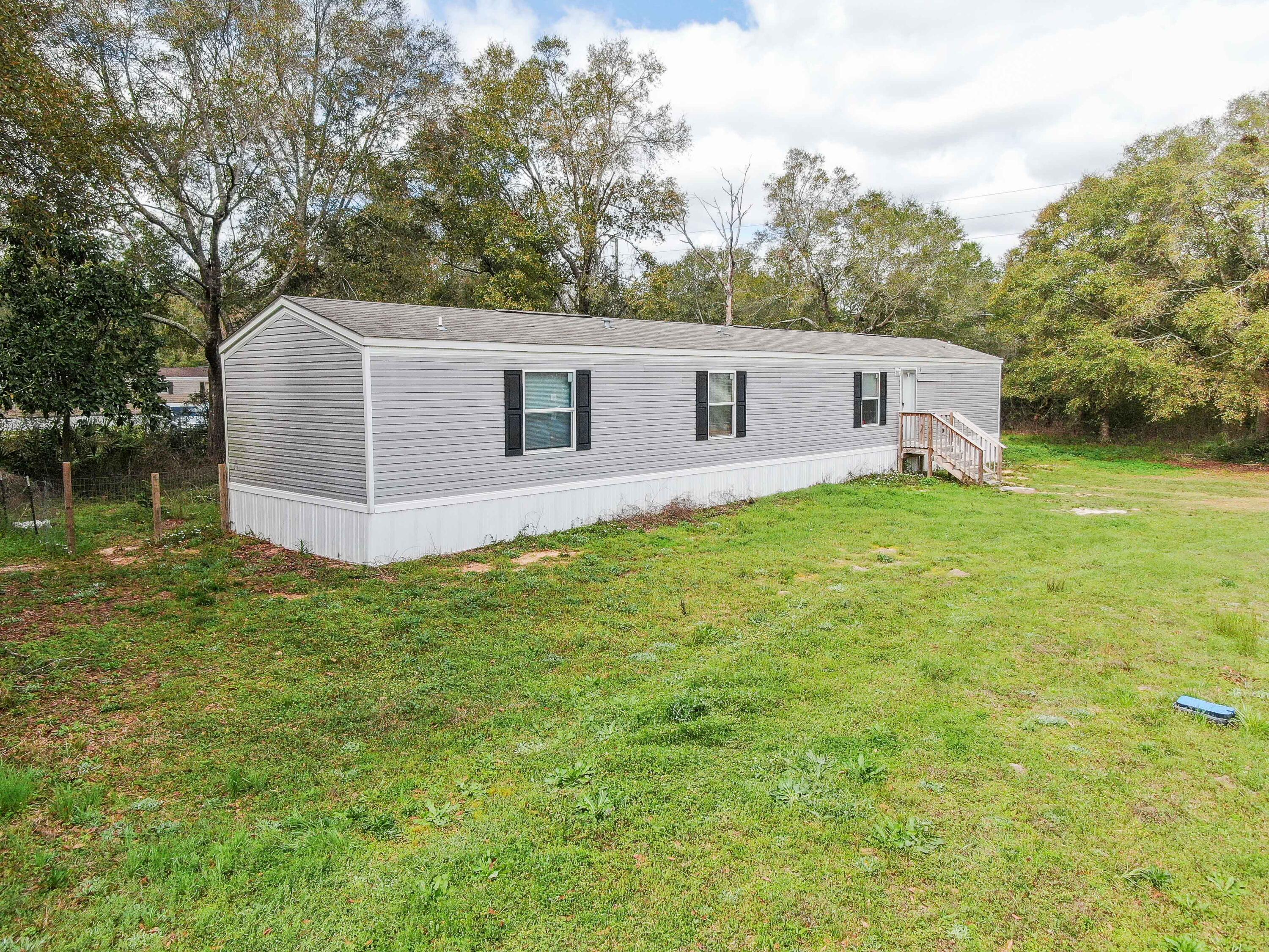 **MOTIVATED SELLER, PRICED TO SELL!!!**Welcome to your conveniently located manufactured home! Built recently in 2021, this lovingly maintained 3 bedroom 2 bath home is move-in ready! Upon entering the home, you'll enjoy the luxurious look and durability of vinyl flooring throughout and a vaulted ceiling over the kitchen and living room, giving a feeling of openness, making it perfect for entertaining. Enjoy relaxing evenings overlooking the fenced in back yard. The home is just 10 minutes from historic downtown DeFuniak Springs, grocery stores, I-10 and an easy 40 minute drive to the pristine white sandy beaches of the Gulf Coast. Schedule your showing today!All Information in the MLS is intended to be accurate, but cannot be guaranteed