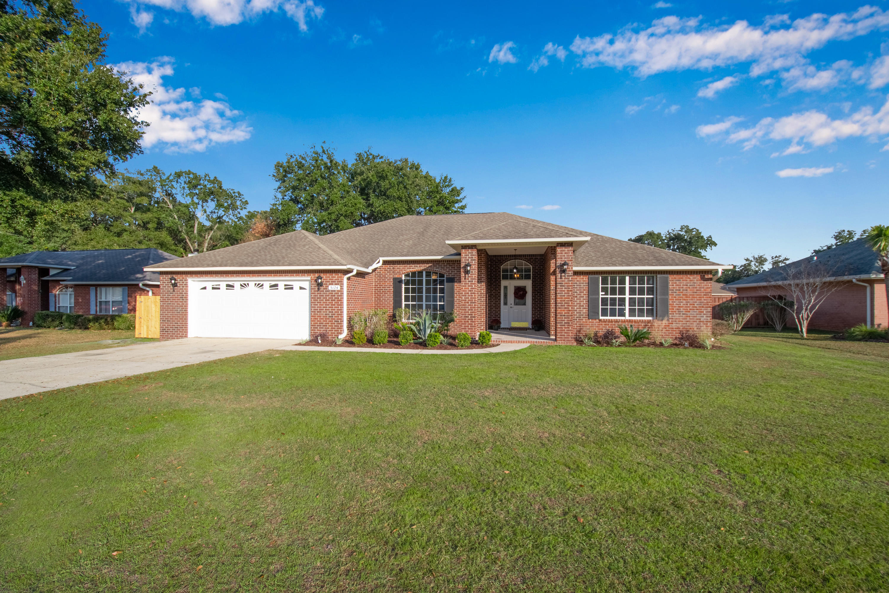 Must see for yourself this centrally located, traditional style brick home. Completely renovated. Large and spacious rooms.So many updates and upgrades-LVP flooring, Quartzite countertops, fabuwood cabinets, new A/C, fresh paint, new light and plumbing fixtures, new stainless kitchen appliances, new garage door opener.Masterbath has 2 walk in closets. Split floor plan.Wood burning fireplace to enjoy this winter. Covered front and back porches. Outside storage shed. 2 car garage.Completely move in ready. It's just missing you.Tour at https://app.suncoastimaging.com/5174-hawks-nest-dr-milton-26905/branded