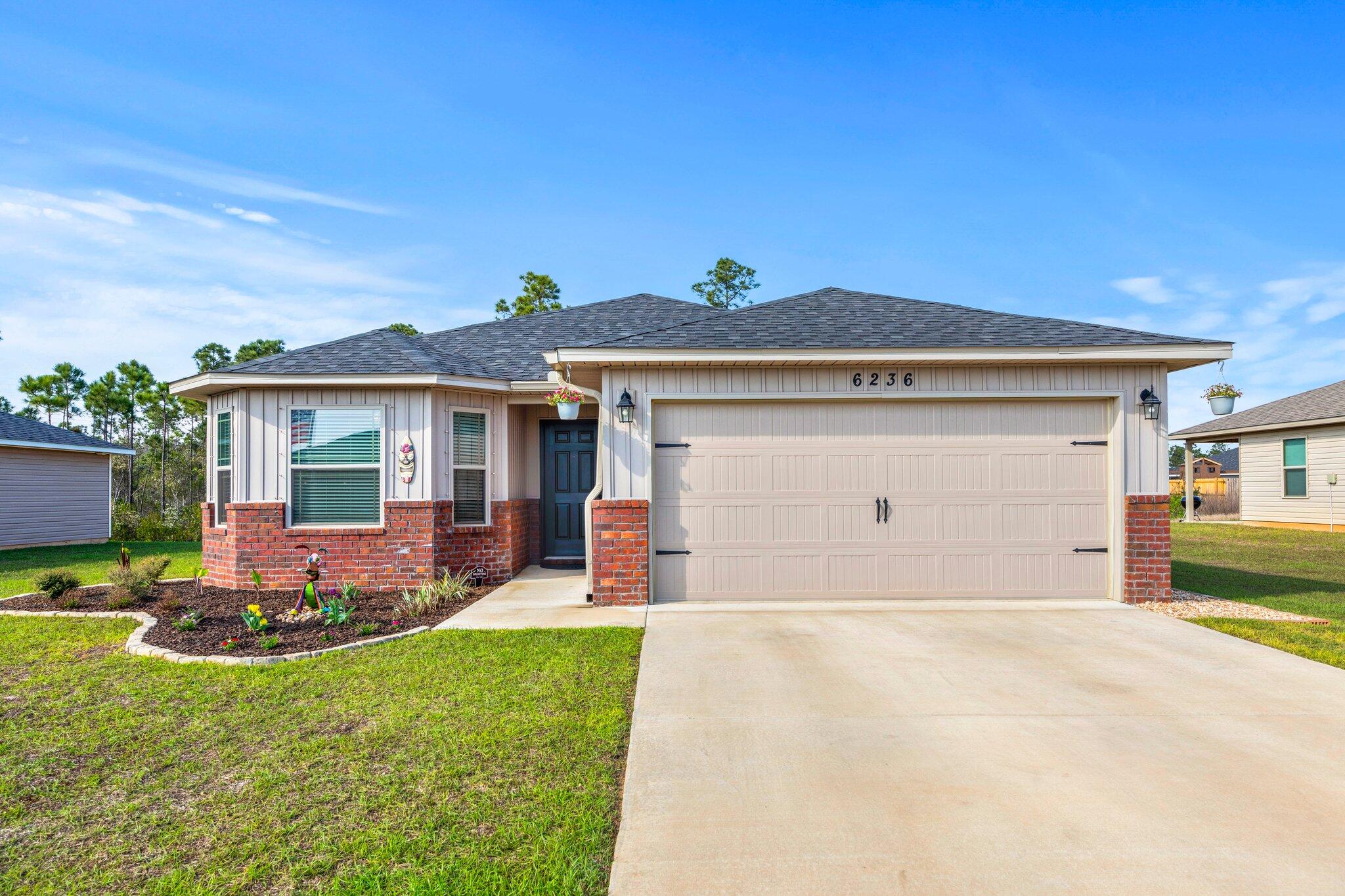 Beautiful like new 3-Bedroom, 2-bathroom home is less than two years old. Popular open floor plan with great room, kitchen, dining area, covered patio, and a 2-car garage. Kitchen features a large island bar, granite countertops, and stainless appliances. Primary bedroom includes an ensuite and is split from the other bedrooms with an ensuite bathroom. Outback is a nice firepit for chilly nights. Fantastic location that is close to Hurlburt & NAS. It's only minutes to Navarre and Pensacola beaches. Call your favorite agent to set up a showing.
