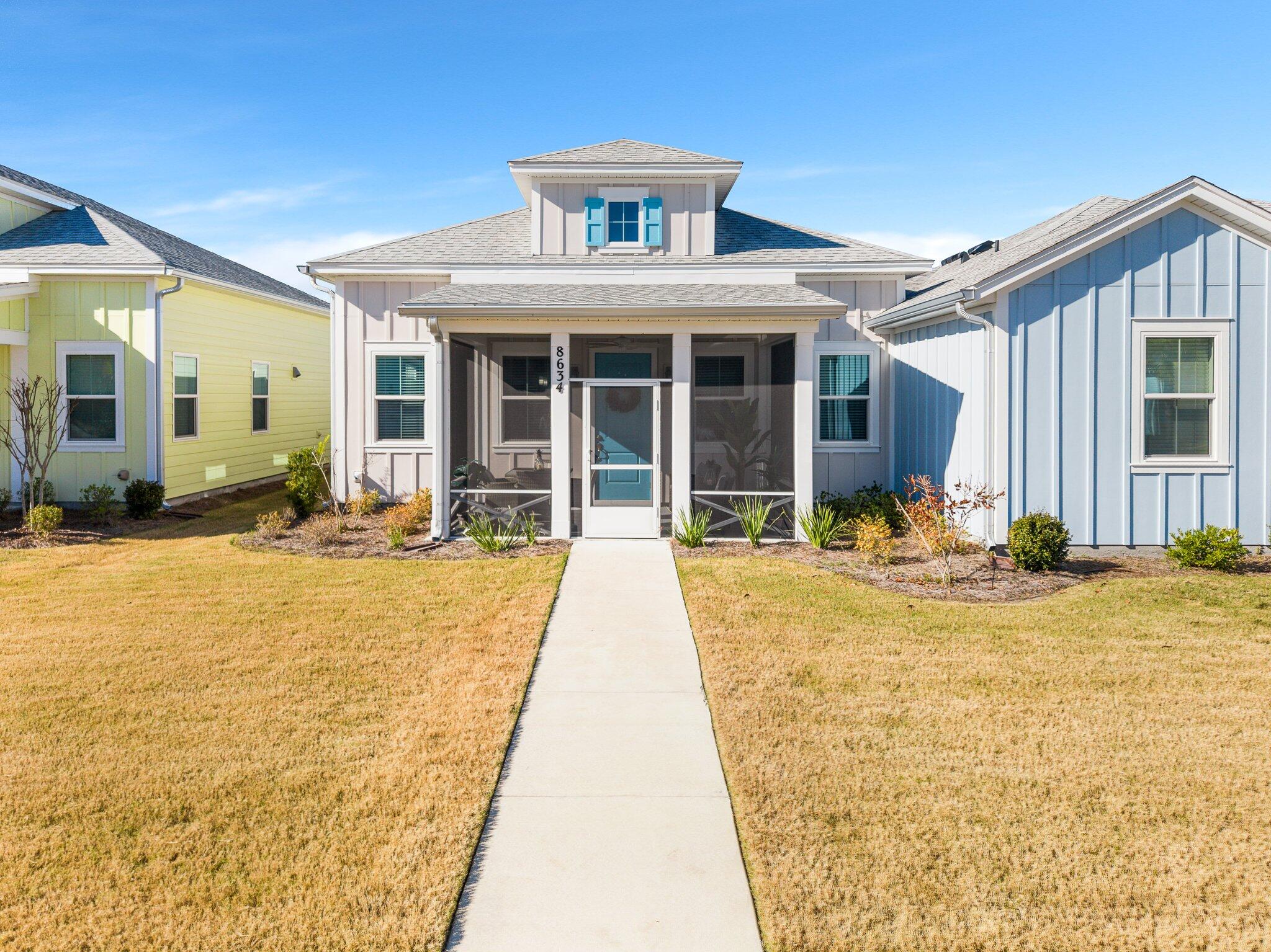 Welcome to your dream retreat in the highly sought-after 55+ community of Latitude Margaritaville Watersound! This stunning Bamboo Cottage with street view invites you to savor your morning coffee on the charming screened-in porch, basking in the warmth of the Florida sun. Step inside to discover a cozy sanctuary filled with upgrades that elevate your living experience. The expansive great room features striking ceiling beams and elegant laminate flooring, complemented by custom paint that captures the essence of coastal living. Your gourmet kitchen is a chef's delight, showcasing a gas range/oven, Level 2 gray cabinetry, and a magnificent quartz countertop adorned with a Level 3 backsplash. Enjoy the convenience of soft-close doors, pull-out shelving, and sleek stainless steel appliances. Both bathrooms offer spa-like retreats with seamless glass shower enclosures and floor-to-ceiling tile walls. The practical laundry room is equipped with a Whirlpool washer/dryer and extra cabinetry for storage, while the immaculate garage features epoxy flooring and a utility sink, rounding out this luxurious package. Don't miss your chance to call this exceptional home yours! Elevate your living experience to new heights as Latitude Margaritaville is the most sought after 55+ community in the country right now with unmatched amenities including a private restaurant with 3 bars, resort pool, live music daily, pickleball, bocce ball, cornhole, putting green, Fins Up Fitness Center, indoor lap pool & whirlpool and a full lifestyle staff who dedicate their days to ensuring your fun! Phase 2 of the amenities has broken ground and includes a full size theatre, Barkaritaville dog spa, woodworking shop, business center and community rooms for clubs, groups, tastings and food demonstrations. The public retail has also begun with the golf cart store in full swing, Capital City Bank is about to open and anticipating the grocery store, restaurants and other boutique shopping soon as well as the Public Marina...all through St Joe!