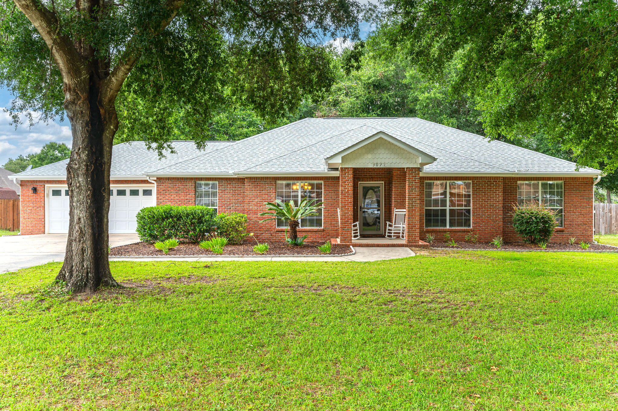 Welcome Home!! Situated on a nice large level lot convenient to town, this 4 bd/2 ba brick home has a 2 car garage and terrific curb appeal. The home features a nice entry area, formal dining room w/ treyed ceiling, living room complete w/ a corner gas fireplace. Kitchen boasts lots of cabinetry and counter space and is roomy enough to accommodate another dining table. Master Suite has a garden tub, separate shower and dual vanities. Guest bedrooms are all a nice size and the 4th bedroom was used as an office. Relax in the heated and cooled Florida room. The home has gutters w/ leaf guard screens. The backyard is complete with RV pad and an open separate patio shaded by mature trees. Outbuilding to convey in AS IS condition. New Roof (2022); New Carpet (2022).