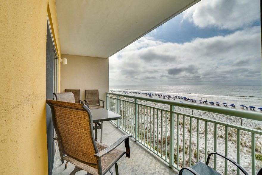 CURRENTLY UNDER CONTRACT, SELLER ACCEPTING BACKUP OFFERSThis gulf front corner unit with wrap around lanai allows for plenty of space for relaxation and entertainment.  Amazing gulf views from this 2BR/2BA, end unit at Pelican Isle. This condo is bright and beachy with additional windows, new laminate wood flooring in the living room, a relaxing large wrap-around balcony surrounds the dining and living room. The kitchen features tile floors, plenty of cabinet & counter top space, and a breakfast bar. The kitchen opens to the living space which has beautiful views and two access points to the wrap-around balcony. There are two nice sized bedrooms, one with a private bath and one with access to the hallway bath. Other features include hallway bunks, washer/dryer, and a wonderful gulf front pool.  The corner unit is close to the stairs for easy beach access. Pelican Isle amenities include 300 feet of deeded beach, community pool, hot tub, & workout room.  **Buyer to verify all measurements**