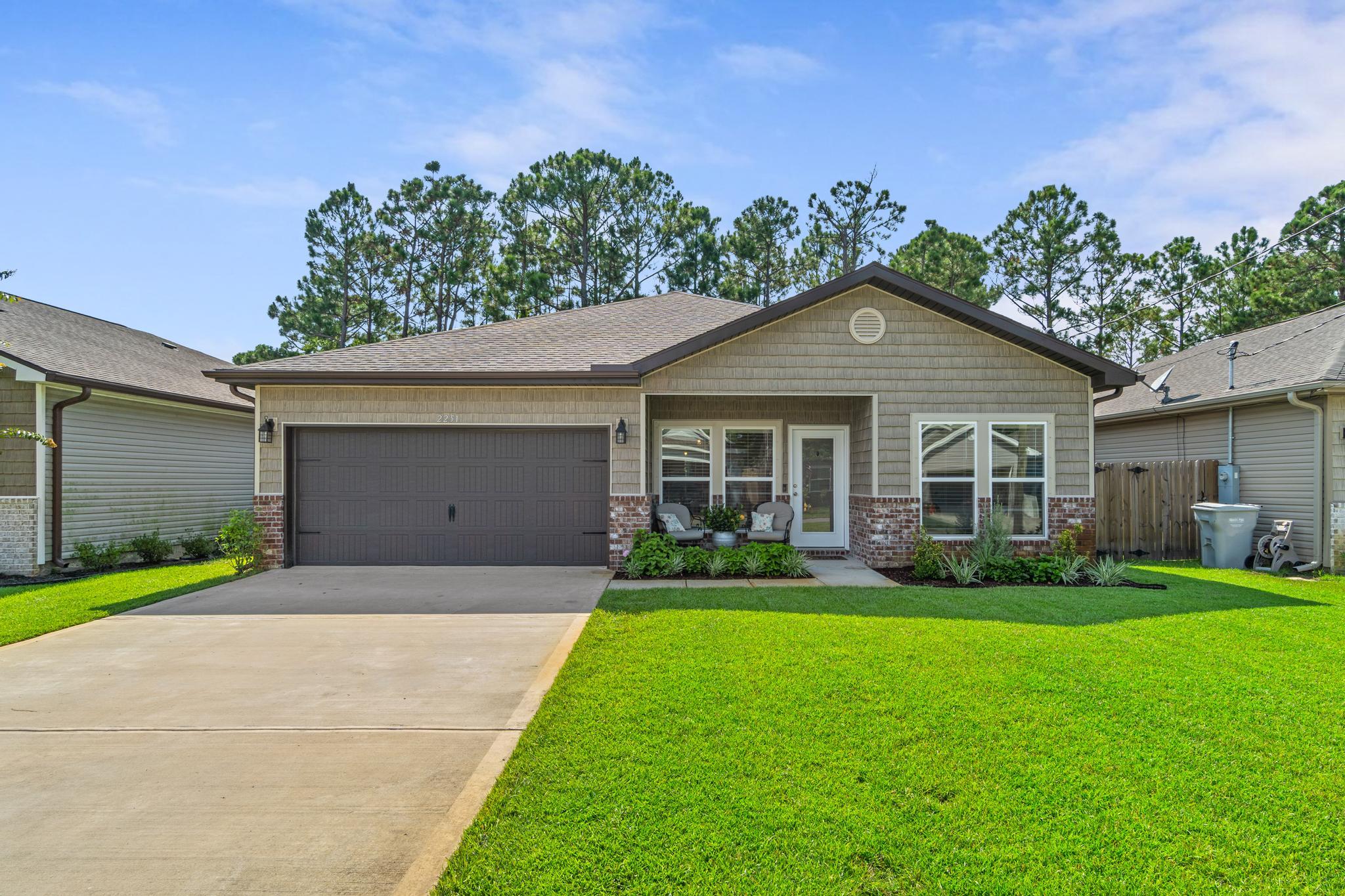 PRICE REDUCTION TO HELP YOU CHECK ALL YOUR BOXES WITH THIS HOME.... SIZE: 4 bedrooms, 3 baths, 2 car garage, approx. 1,996 sq ft with large deck. LOCATION: Perfectly located near Hurlburt base and easy access to Eglin AFB, the beautiful white sandy beaches, shopping, schools, entertainment, and medical. Tom Street is on the north size of Hwy 98, just 1 minute past the Santa Rosa County line. CONDITION AND FEATURES: Enjoy a like new, move-in ready, Craftsman style home with great curb appeal, built in 2019 by Tracy Acree, this home has 10 Ft. ceilings throughout main living areas, as well as wood-look tile flooring throughout main/ wet areas. As you enter the home, the dining room is to the left front and leads into the kitchen, which boasts custom cabinetry,