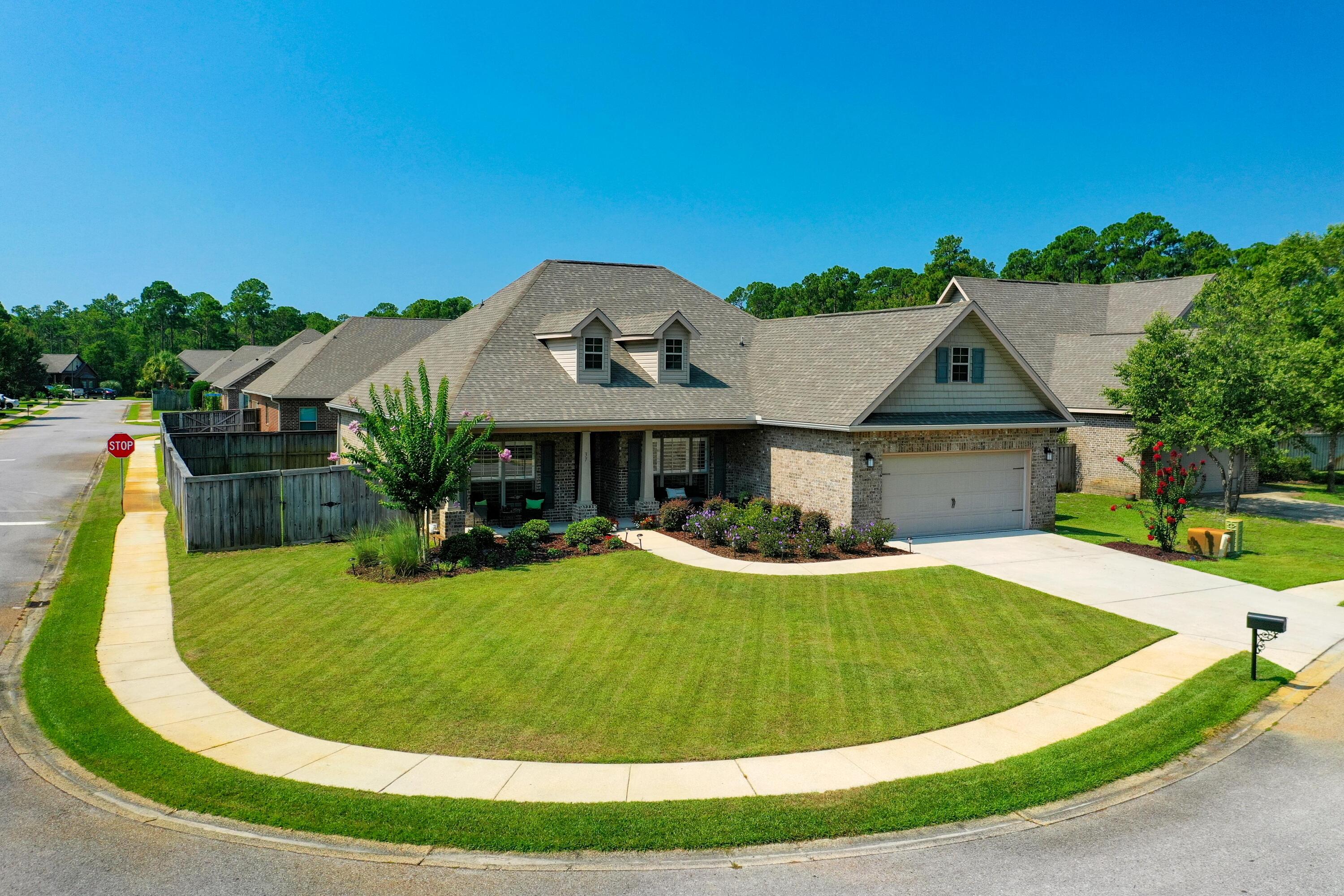 SHARPLY REDUCED! Beautiful one-story home situated on a corner lot in a gated Santa Rosa Beach neighborhood; conveniently located to the best attractions and businesses of the Emerald Coast of South Walton County, Florida! The residence features clean, elegant interiors, with a vaulted ceiling in the spacious living room/eat-in kitchen--an ideal space for entertaining! Plus there's a formal dining room and powder room, as well as a separate office. Recent upgrades include upgraded and remodeled bathrooms, luxury vinyl flooring throughout with neutral coloring that hides dirt and complements any decor scheme, new interior paint throughout, plantation shutters, recessed lighting and ceiling fans, and whirlpool kitchen appliances.