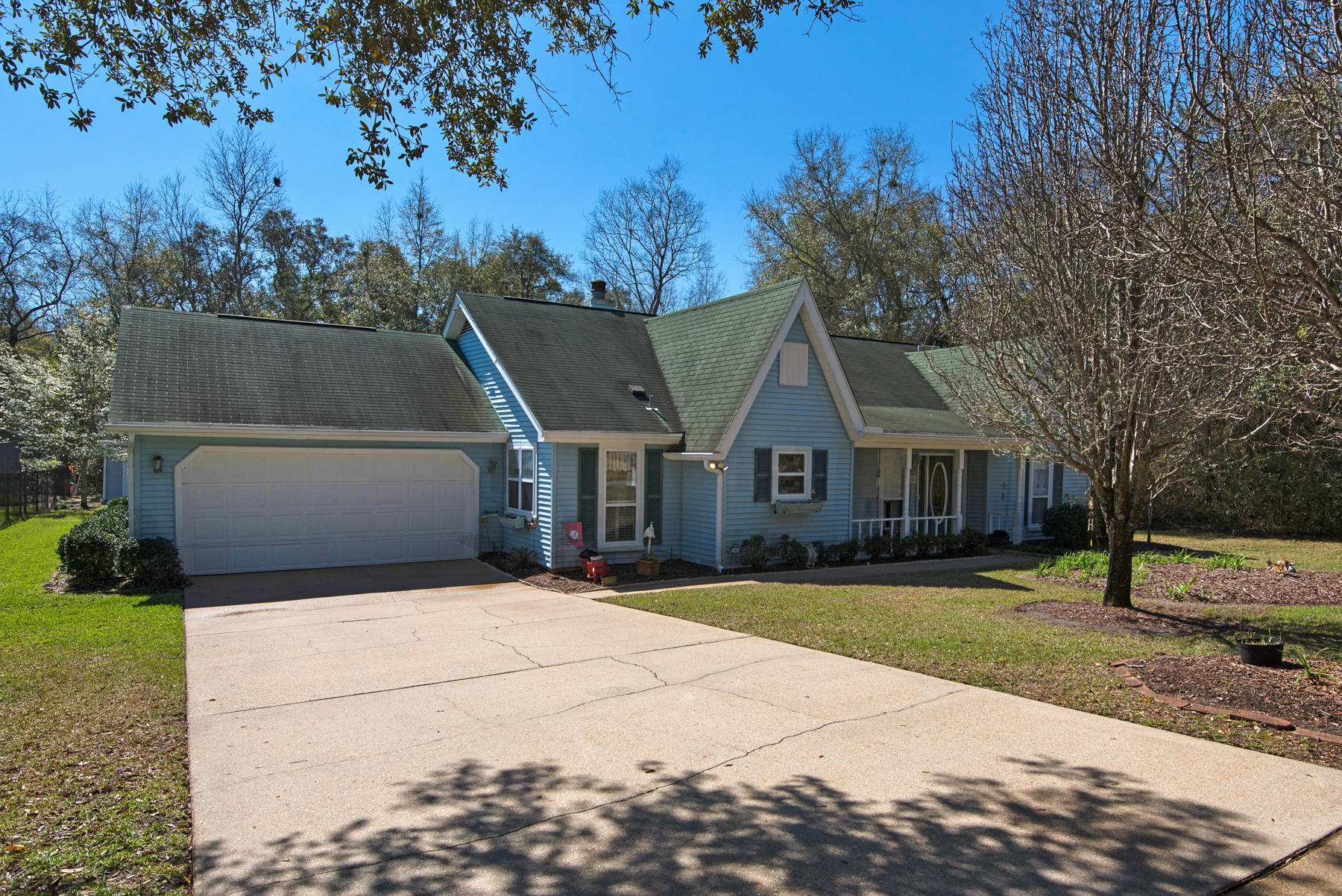 Leave your ''Big City'' worries behind and feel your stress melt away as you head into the country-like atmosphere of Lake Sharon Estates. Only 7 minutes from the Mid-Bay Bridge in Niceville. This quaint country style home is perfect for those that want all of today's modern conveniences with a hint of a simpler time and place. A bright and sunny kitchen will welcome you to enjoy a morning cup o'Joe before starting your morning routine. On the weekends, relax while gardening and tending to the beautiful native plant life around the property or perhaps pick up a new hobby in wood working or refinishing in your very own separate workshop. This large lot has plenty of room for a Spring garden and the lake has plenty of fish! Come out to view this special property TODAY!