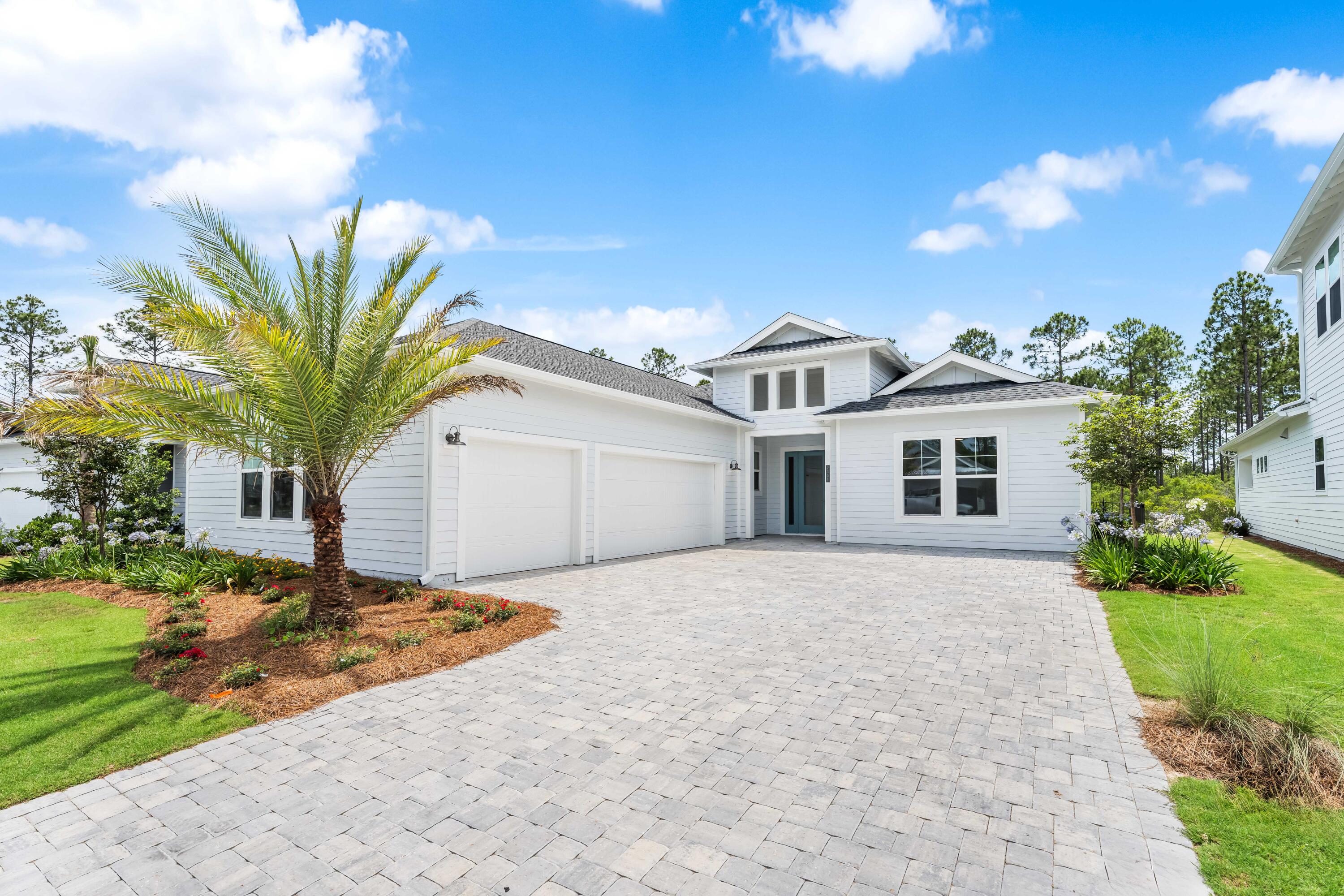This stunning new build in Naturewalk at Watersound Origins features 3 bedrooms, 3 full bathrooms and a spacious den, plus a 3-car garage. Pristine finishes and upgrades throughout. A bifold back door opens fully to a pool & spa with forest and pond views. Available immediately!