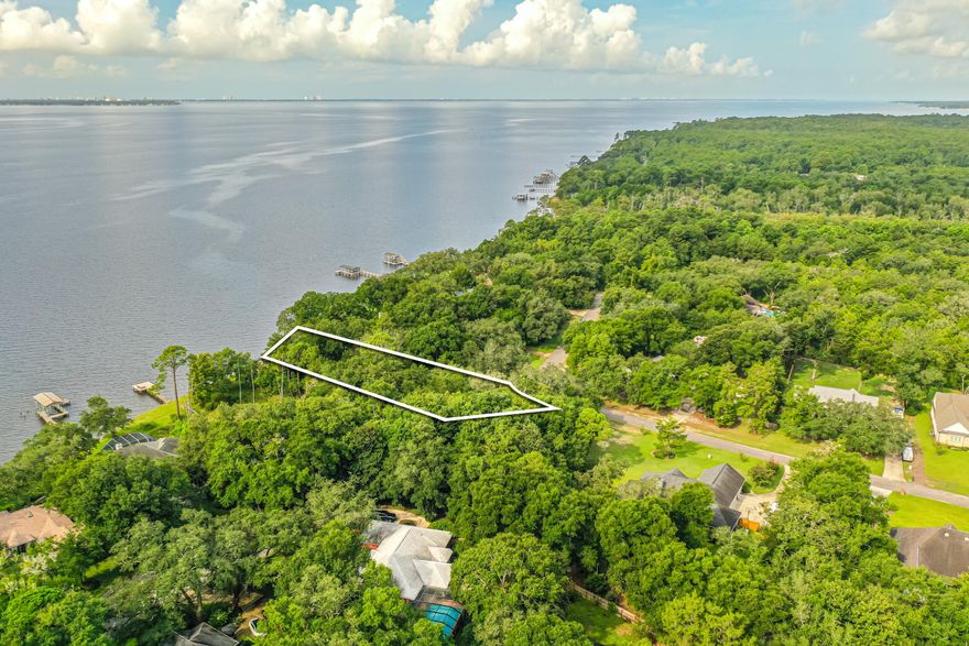 Welcome to your future home site! This beautiful vacant lot comes with 108 feet of serene waterfront on two thirds of an acre, providing the perfect backdrop for your dream home. Recently bush hogged, the property features beautiful trees and a canvas for you to build upon.Situated on a generous parcel, this lot offers a unique blend of natural beauty and potential. Survey available. Listed below recent appraised value!