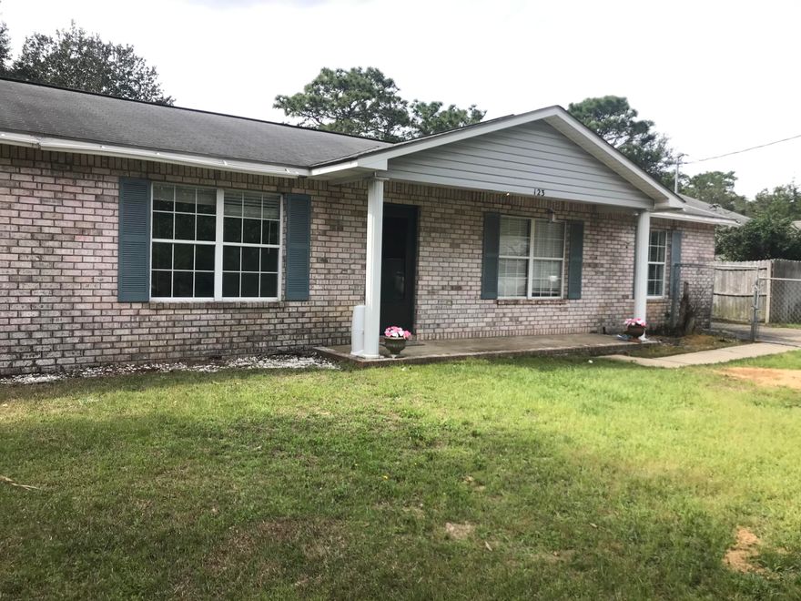 Remarkable All Brick Home, just minutes West of Hurlburt Field, and minutes away from Navarre Beach. This home has 18'' ceramic tile, carpet in bedrooms only. Home features walk in closets, large linen closet, two living areas, separate dining room, and completely fenced yard. This home is a on a quiet street, and backs up to St Peter's Catholic Church. Extra storage for lawn equipment in metal storage building. Seller is providing a 1 Year Home Warranty, Call to schedule your private showing today.