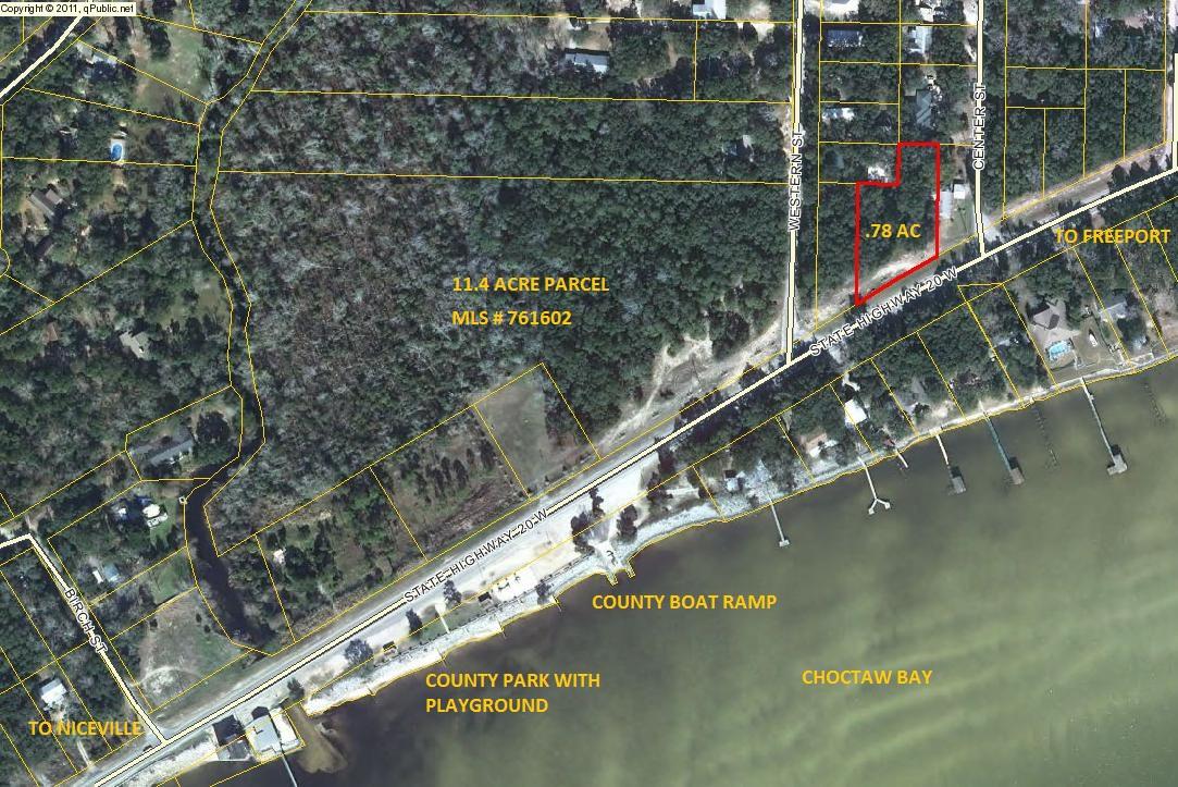 Beautiful .78 acre wooded lot in Choctaw Beach area across from Public park and boat launch with great views of Choctawhatchee Bay. Zoned RV (Rural Village). May be developed residential or commercial. Buyer to verify all dimensions. Seller also has an additional 11.4 acre parcel for sale to the West of this parcel. The MLS is # 761602.City water only available. Buyer to confirm all dimensions.