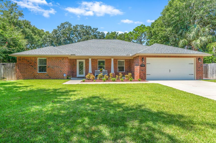 This newer home is one level and a true split floor plan. The master suite is huge. The other rooms are also spacious and this home has been kept in immaculate condition. The carpet is brand new and it has just been painted. The yard is amazing with a privacy fence, a new deck, and sprinkler system (with plenty of room for a pool) located just off the gourmet kitchen. The kitchen is open and perfect for entertaining with granite countertops, stainless and soft close drawers. Upgrades throughout include crown molding, trayed ceilings custom tile work, hurricane shutters, a security system. Walk in master closet with organization system. The guest closets have adjustable organizational systems as well. A termite bond is in place This brick home is move in ready and low maintenance.