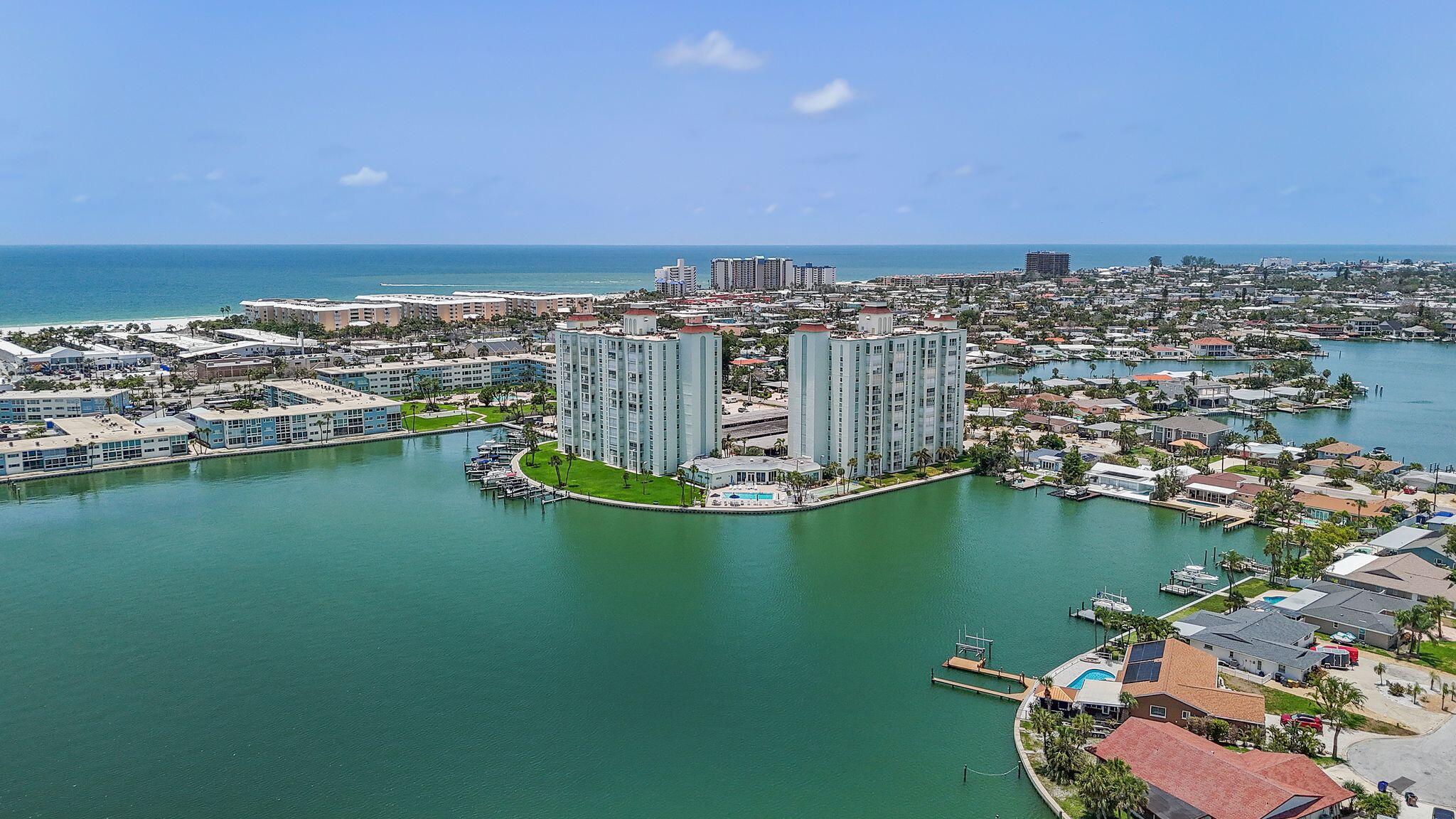 Experience elevated coastal living in the sought-after Three Palms Pointe community in St. Pete Beach. This stunning 9th-floor condo offers 1,300+ sq ft with 2 spacious bedrooms, 2 full baths, and panoramic views of Tampa Bay. The open layout is filled with natural light, and the private balcony is perfect for enjoying sunrise coffee or sunset cocktails. Enjoy a well-equipped kitchen and spacious living/dining areas. This gated waterfront community offers 24-hour security, heated pool, fitness center, sauna, clubhouse, fishing pier, kayak/bike storage, and boat slips by reservation. Just blocks from the beach, dining, and attractions--ideal as a full-time home, vacation getaway, or investment.