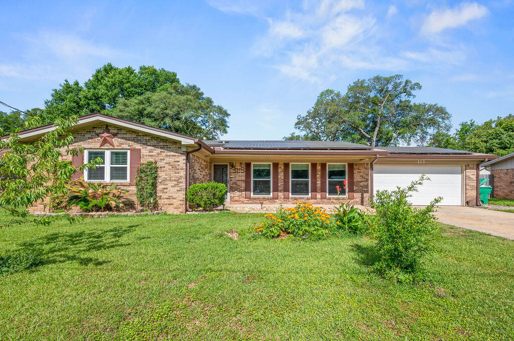 Seller is offering a $7,500.00 credit towards buyers closing costs/prepaids! Prime location in the heart of Niceville walking distance to Ruckel Middle School, Niceville High, restaurants and shopping! Only minutes to Eglin AFB, and about 20 minutes to Duke Field and 7th Special Forces. This beautiful home has tile floor throughout, 2 living areas, 3 spacious bedrooms, 2 full bathrooms and a 2 car garage. Hot water heater was replaced in 2025, dishwasher is brand new, new roof 2023, and stove/oven replaced 2023. Large renovated yard building is insulated, has plank floors, electricity and an A/C unit making it a great workshop, exercise room or place for guests to stay. Solar panels were installed in 2020 and are paid off. Quiet cul-de-sac with no HOA. Don't miss this opportunity!!