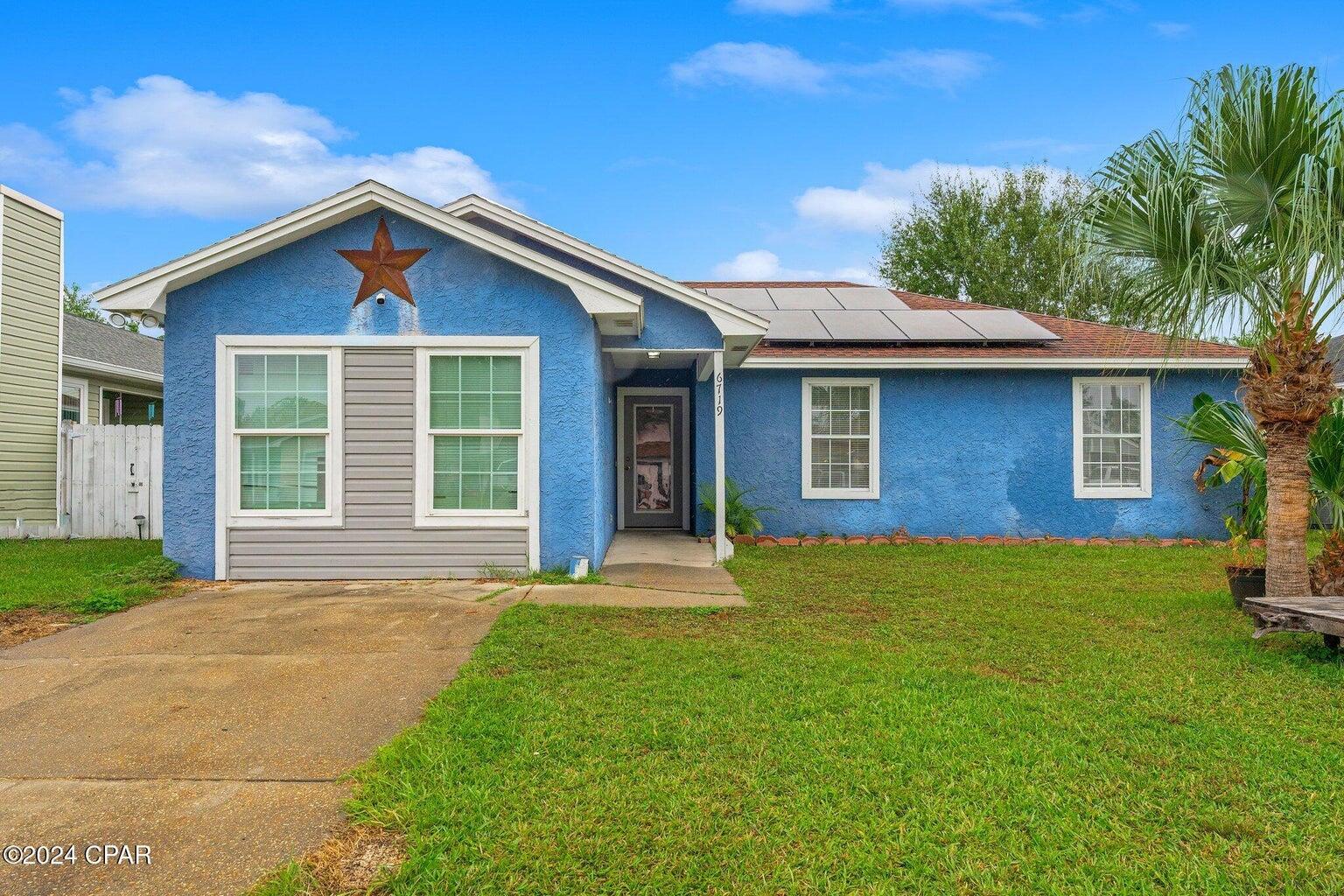 This charming 3 bedroom 2 bath home is located near the Tyndall Air Force base. As you enter the home you'll find the garage has been converted into a large Bonus room. If you need a garage it can easily be converted back. With the combination of of new LVP flooring and the updated kitchen and bathrooms this home offers a modern and welcoming atmosphere. As you enter the backyard you'll find an oversized fenced back yard equipped with a built in bar and shed for storage. This home comes with solar panels which will be paid off at closing! Call your agent today for a private showing.