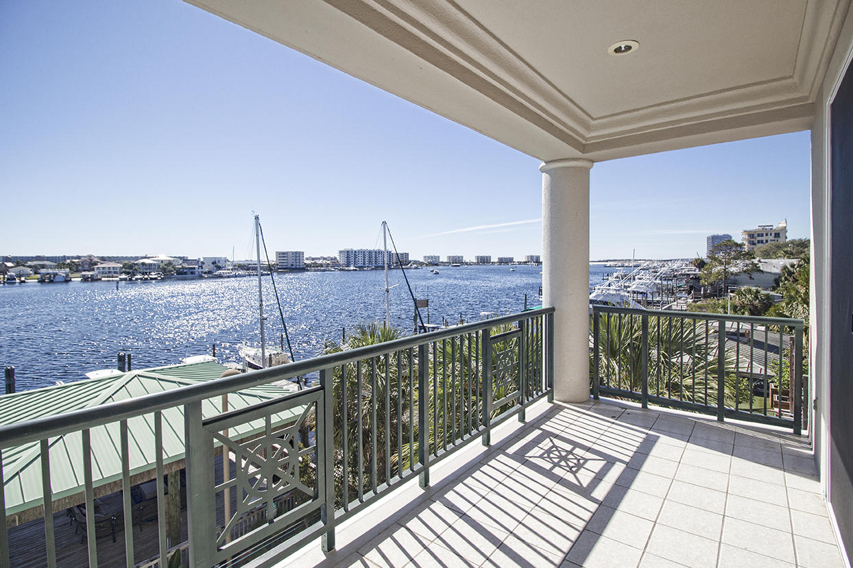 This large 3 bedroom condo is located directly on the beautiful Destin Harbor and even includes a 20' x 40' boat slip. The covered patio on this corner unit offers incredible views to the south and west and all 3 bedrooms include full baths. Additionally, covered parking is available below the building as well as a storage room for the unit. This condo will be sold at Absolute Auction, meaning it will sell to the highest bidder regardless of price!