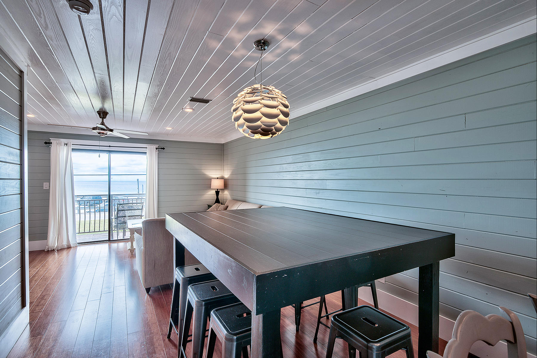Gulf views galore in this renovated Miramar Beach townhome. Set to gross more than $50K in 2017 vacation rental income, this Costa Vista rental machine makes the cut for investors. This homes total renovation completed in 2014 portrays a relaxed, stylish, coastal aesthetic against clear views of emerald waters. Featuring unique architectural elements like painted wood plank walls, white wood plank ceilings, custom millwork, imported Carrera marble tile, hardwoods and custom, solid doors, this home is expressively designed. Just steps from beach access, this unit provides Gulf views from its master suite, living area, and 2 spacious Gulf side balconies. Kitchen features granite counters, new stainless steel appliances, custom cabinetry, and a breakfast bar. All 3 baths are updated with granite counters, Carrera marble, and custom cabinetry. This home is rental or move-in ready.
Costa Vista Townhomes is located directly across the street from the Gulf of Mexico in Miramar Beach and just a short walk to dining and activities. Owners and guests have full access to the community pool.