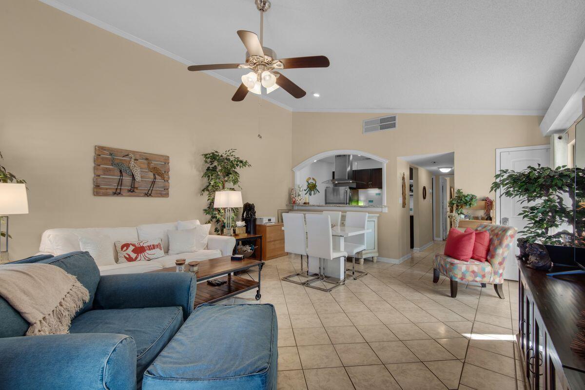 Tucked away behind the gates of desirable Seascape Resort, this charming villa is in pristine condition and is full of upgrades. Tennis lovers will enjoy this two-bed, two-bath unit located in the Tennis Village, a neighborhood with access to lighted, hard-surface and professional tennis courts. Tennis Village is also a favorite among vacationers, thanks to covered parking and large, enclosed outdoor patios, both of which are unique features for Seascape Resort. A rarity to see on the open market, this unit features a remodeled kitchen with backsplash, granite countertops, bar seating, a hood range and stainless appliances. The owner's suite is generously sized and has an updated bath with a walk-in shower and easy access to the outdoor patio. The guest bedroom is also