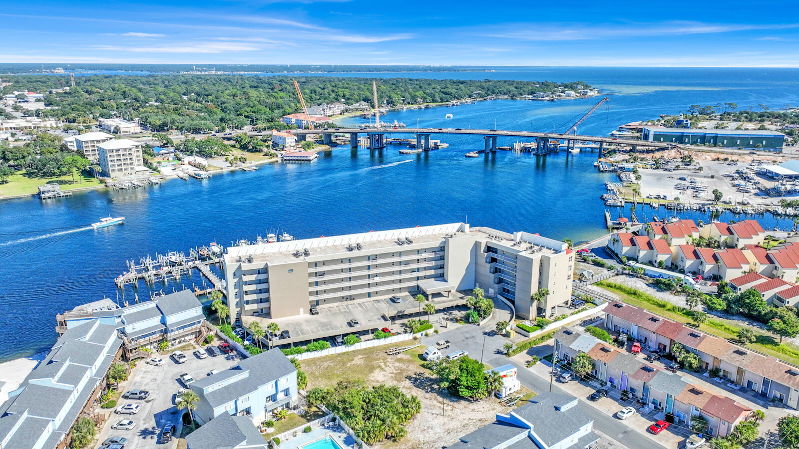 Stunning 2-Bedroom Condo with Gulf & Sound Views! A beautifully updated and fully furnished 2-bedroom, 2-bath condo with breathtaking views of the Gulf, Intracoastal, and Santa Rosa Sound! This warrantable condo features luxury vinyl plank (LVP) flooring throughout, a modern kitchen with granite countertops, stainless steel appliances, and ample pantry/storage space. The unit includes a convenient stackable laundry area, and both bedrooms have ensuite bathrooms. The master suite boasts a relaxing tub and a separate tiled shower, while the second bedroom offers a tiled shower as well. Included with the condo is a deeded 25' boat slip with a lift, perfect for boating enthusiasts! Additionally, the unit comes with a deeded parking space in the covered garage and a garage storage locke The gated complex offers great amenities, including a shared pool, hot tub, and grill area. Take a 5-minute stroll along the boardwalk to enjoy easy beach access. You'll also be front and center for local events like the Billy Bowlegs Boat Parade! Located just minutes from Eglin AFB, Hurlburt Field, pristine beaches, parks, and shoppingthis condo is a perfect coastal retreat.