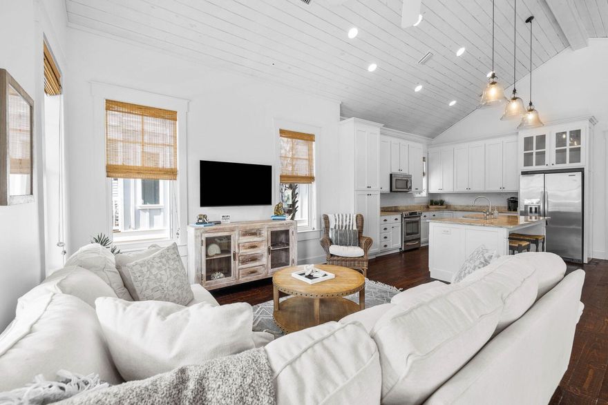 This surprisingly spacious beach cottage is perfect for laid-back luxury living, with shiplap and sliding barn doors adding a rustic touch to the coastal decor. The location could not be better, backing onto mature forest and a walking/bike path leading to Seacrest Beach amenities. The white sandy beach and 12,000-sq.-ft. community pool is conveniently close by, along with 30A shopping and dining. Plus, the home's walkability to the upscale shops, restaurants, and events in Rosemary Beach and Alys Beach means you'll have the best of 30A living right at your doorstep. This beautifully presented turnkey property is freshly painted and fully furnished. You'll feel at home the moment you step onto the front porch.Dark wood floors and a lofty vaulted ceiling add character, while a parade of tall windows cast abundant natural light into this bright, airy living space. The dining table easily seats eight for mealtimes and board games, while a lengthy window seat provides a natural space for kids to hunker down with their video game console. Indulge your culinary passions in the open-concept kitchen, which has everything you need to cook and entertain. A center island showcases a beautiful yet practical granite counter with a butler's sink and breakfast bar seating for three.

Two king-size master suites are on the main floor, along with a spacious twin bedroom. One of the primary suites has a small private balcony for quiet times, and all have lavishly appointed bathrooms. Stairs lead down to a basement level complete with a laundry room, media room, and a custom bunk room to sleep four. Imagine cozy evenings curled up on the sofa watching your favorite movie after a fun day of swimming, shelling, and dolphin spotting. French doors can be opened wide to provide a seamless transition onto the rear covered porch for barbecues and social gatherings. There's ample space for lounging and reading in the sun, with mature greenery providing ample privacy.

Located in the heart of Seacrest Beach, this four-bed, four-bath home is conveniently close to a walking/biking path, making it easy to spend time at the nearby lagoon pool and the endless white sandy beach. Whether you're looking for a peaceful luxury retreat, a family vacation home, or a rental opportunity, this versatile home checks all the boxes.