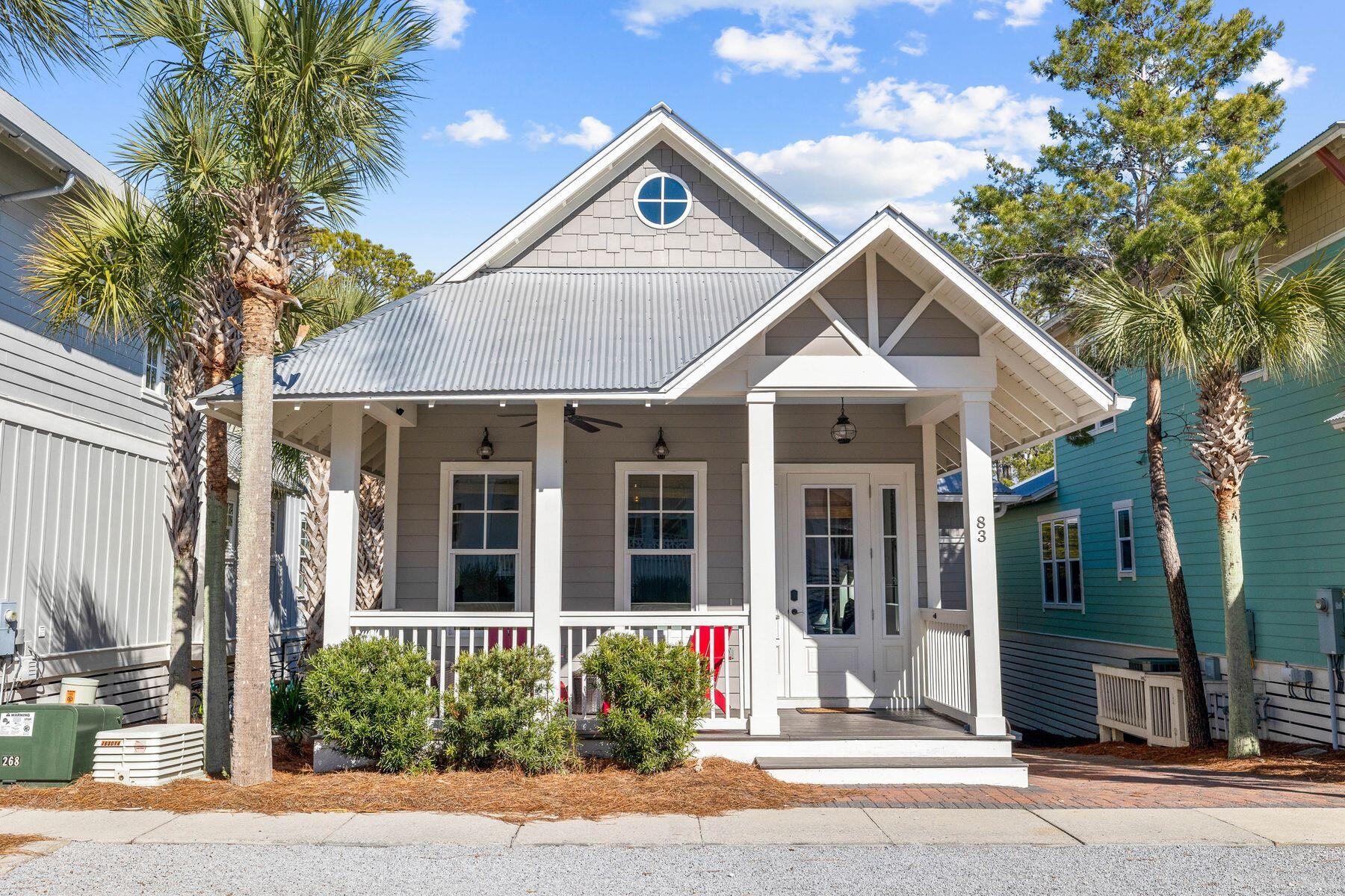 This surprisingly spacious beach cottage is perfect for laid-back luxury living, with shiplap and sliding barn doors adding a rustic touch to the coastal decor. The location could not be better, backing onto mature forest and a walking/bike path leading to Seacrest Beach amenities. The white sandy beach and 12,000-sq.-ft. community pool is conveniently close by, along with 30A shopping and dining. Plus, the home's walkability to the upscale shops, restaurants, and events in Rosemary Beach and Alys Beach means you'll have the best of 30A living right at your doorstep. This beautifully presented turnkey property is freshly painted and fully furnished. You'll feel at home the moment you step onto the front porch.Dark wood floors and a lofty vaulted ceiling add character, while a parade of tall windows cast abundant natural light into this bright, airy living space. The dining table easily seats eight for mealtimes and board games, while a lengthy window seat provides a natural space for kids to hunker down with their video game console. Indulge your culinary passions in the open-concept kitchen, which has everything you need to cook and entertain. A center island showcases a beautiful yet practical granite counter with a butler's sink and breakfast bar seating for three.

Two king-size master suites are on the main floor, along with a spacious twin bedroom. One of the primary suites has a small private balcony for quiet times, and all have lavishly appointed bathrooms. Stairs lead down to a basement level complete with a laundry room, media room, and a custom bunk room to sleep four. Imagine cozy evenings curled up on the sofa watching your favorite movie after a fun day of swimming, shelling, and dolphin spotting. French doors can be opened wide to provide a seamless transition onto the rear covered porch for barbecues and social gatherings. There's ample space for lounging and reading in the sun, with mature greenery providing ample privacy.

Located in the heart of Seacrest Beach, this four-bed, four-bath home is conveniently close to a walking/biking path, making it easy to spend time at the nearby lagoon pool and the endless white sandy beach. Whether you're looking for a peaceful luxury retreat, a family vacation home, or a rental opportunity, this versatile home checks all the boxes.