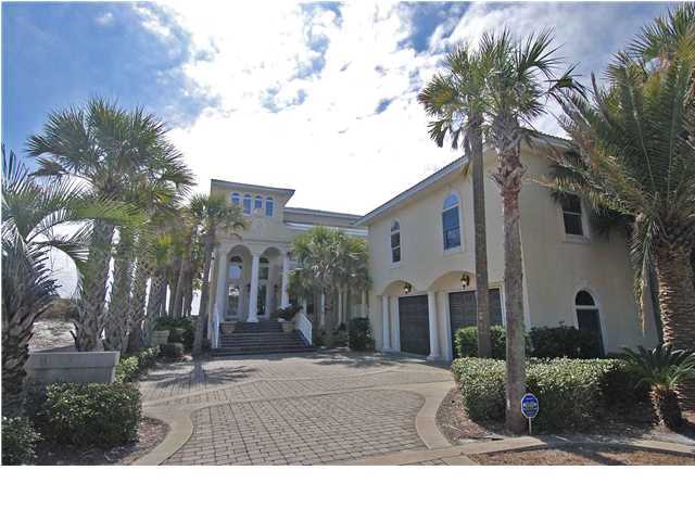 BEYOND YOUR IMAGINATION! Sensational panoramic Gulf views from all three floors of this remarkable 7 bedroom, 6,207 sq.ft. gulf front home with carriage house & Gulf-side heated pool. Upon entering, the impressive foyer offers a dramatic entrance with a curved staircase. On the first floor you'll find a living room with gas fireplace, wet bar, dining room with huge arched picture windows overlooking the Gulf, gourmet kitchen featuring a large curved breakfast bar, center island, Corian counter tops, 2 Viking gas ovens, cook top, food warmer, sub-zero refrigerator, trash compactor, and ice maker; a media room with surround sound; there is also a one full bath, one half bath, a huge utility room & an elevator to all 3 floors. The second floor features the master suite with balcony