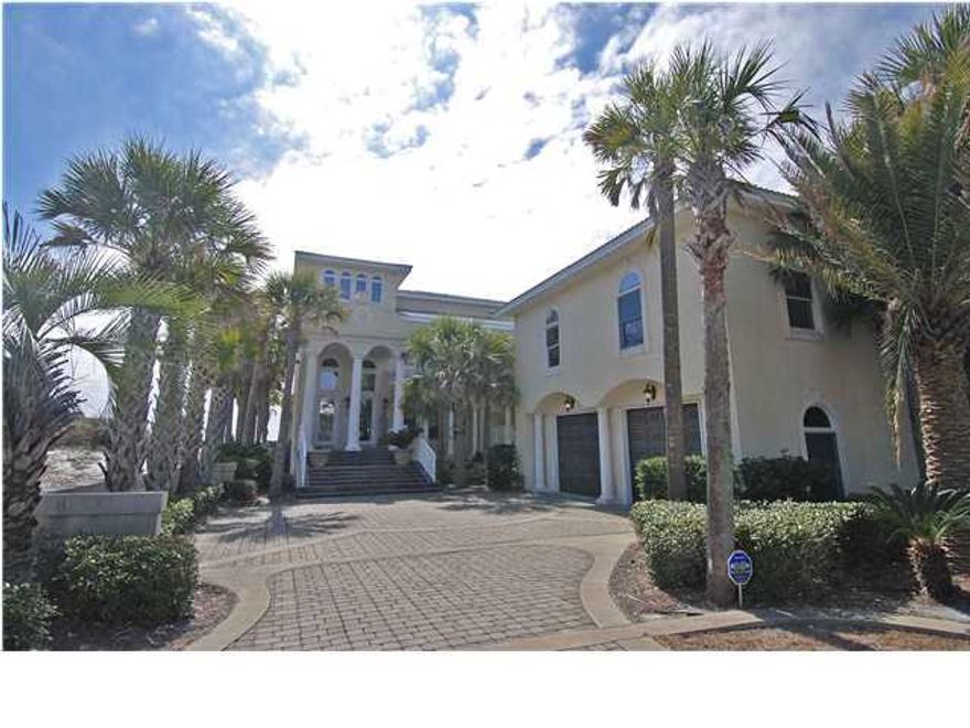 BEYOND YOUR IMAGINATION! Sensational panoramic Gulf views from all three floors of this remarkable 7 bedroom, 6,207 sq.ft. gulf front home with carriage house & Gulf-side heated pool. Upon entering, the impressive foyer offers a dramatic entrance with a curved staircase. On the first floor you'll find a living room with gas fireplace, wet bar, dining room with huge arched picture windows overlooking the Gulf, gourmet kitchen featuring a large curved breakfast bar, center island, Corian counter tops, 2 Viking gas ovens, cook top, food warmer, sub-zero refrigerator, trash compactor, and ice maker; a media room with surround sound; there is also a one full bath, one half bath, a huge utility room & an elevator to all 3 floors. The second floor features the master suite with balcony