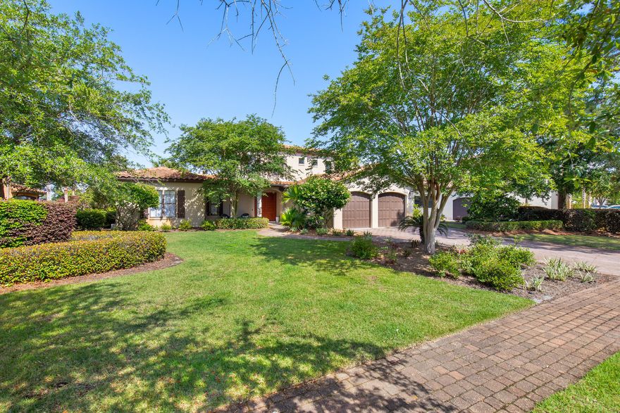Tucked within the prestigious Genoa neighborhood at Sandestin Golf and Beach Resort, this Mediterranean-style home offers an inviting blend of warmth, elegance, and easy resort living. Set behind a charming stone bridge and centered around a sparkling lake with a fountain, Genoa is known for its stately homes and peaceful, private setting on the bayside of Sandestin.This thoughtfully designed floor plan lives mostly on the first floor, centered around a bright, open living space where travertine floors, high coffered ceilings, and French doors create a relaxed yet refined atmosphere. The kitchen, outfitted with stainless steel appliances and abundant storage, flows seamlessly into the living and dining areas, all overlooking the pool, lake, and Baytowne Golf Course beyond. The screened-in outdoor area is a true retreat, with a sparkling pool, hot tub, covered patio, and cozy gas fireplace, perfect for year-round enjoyment. Fruit trees, potted plants, and lakeside views complete the lush Mediterranean feel.

The oversized primary suite features private pool access, dual closets, and a spacious bath with a soaking tub and separate shower. A second guest room and office are also conveniently located on the first level, with two additional bedrooms upstairs for family or guests.

A two-car garage plus golf cart bay provides plenty of room for storage and adventure, whether heading out to explore the resort's world-class amenities or the nearby Grand Boulevard Town Center. Owners at Sandestin enjoy access to four championship golf courses, tennis and pickleball courts, miles of biking and hiking trails, a 210-slip full-service marina, and the vibrant Baytowne Wharf for dining, shopping, and entertainment. Grand Boulevard, with its array of shops, upscale restaurants, movie theater, coffee shops, and Publix, is just a short golf cart ride away.