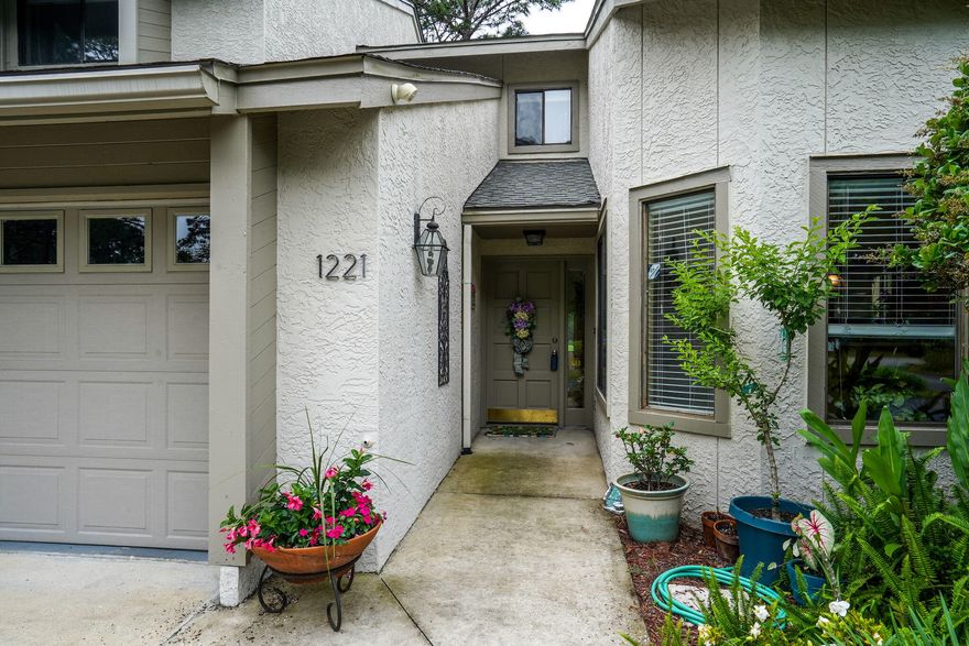WELCOME HOME to this spacious and carefree townhome. Enjoy the ease of the Main Bedroom suite being on the first floor with views of the gardens that are taken care of by the association. The living room is spacious and bright with cathedral ceilings and doors out to the patio. $2500 floor credit!!!  You will love the dining area which is open to the family room for easy entertaining.  The kitchen is charming with the beautiful glass tile reminding you of our amazing white sand beaches. Upstairs is a open living space that is convenient for children, an office or additional relaxation space for guests.  Some have walled this in for another bedroom The guest bedrooms are wonderfully oversized with a ton of storage.  You will never feel cramped in this townhome that features a 2 car garage.