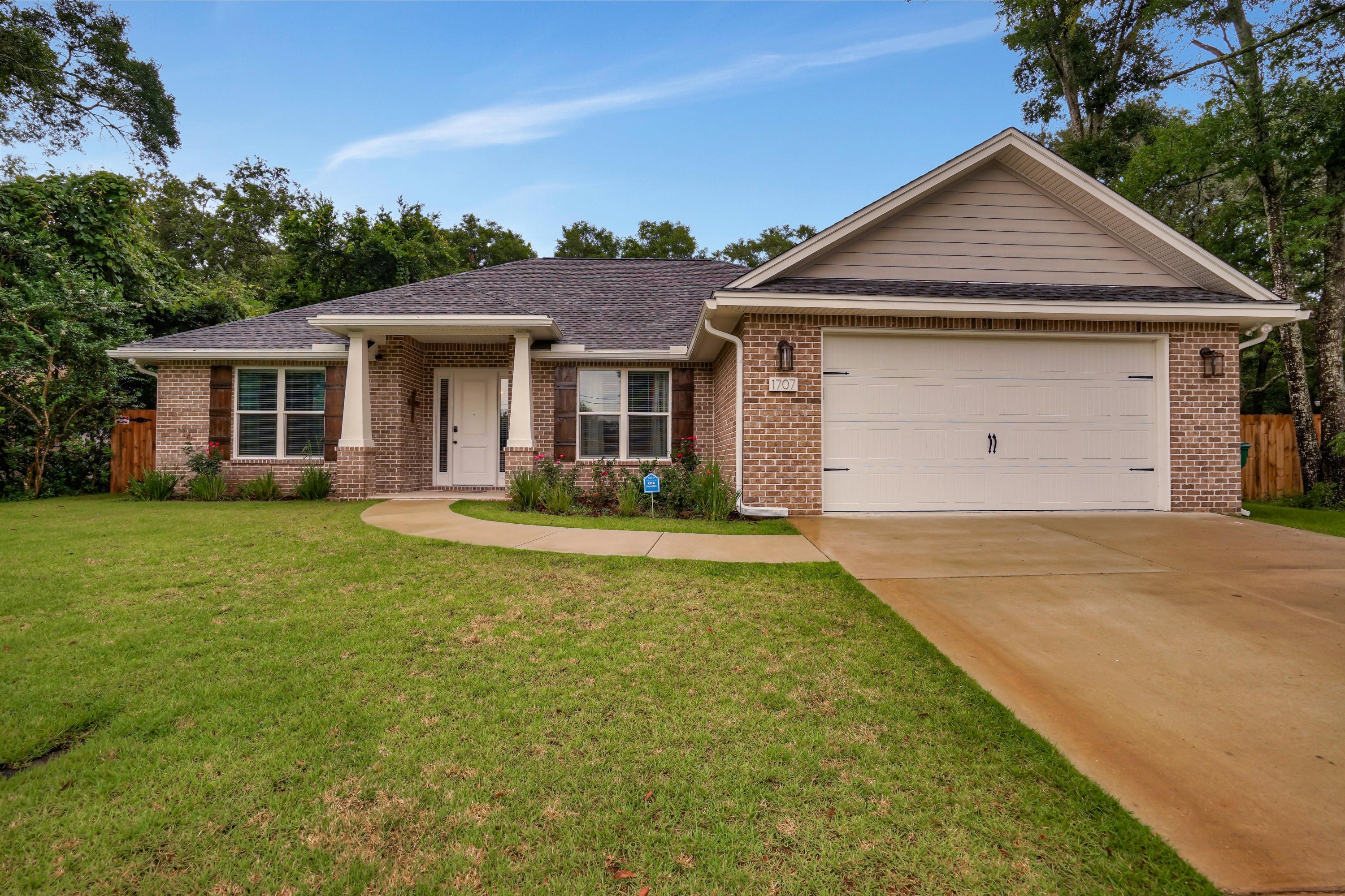 Gorgeous newly built 4 bedroom 2 bath home in the heart of Niceville. This home has a fantastic floor plan with no wasted space. Not a builder basic this home was upgraded to include wood look porcelain tile in master and all living areas, wood shelving throughout, light fixtures, stainless appliances and apron sink, crown molding throughout, custom faux wood blinds, custom stained wood shutters and seamless rain gutters. Large laundry mudroom has overhead cabinetry as well as plenty below with granite countertops. The master bath suite has a freestanding soaking tub as well as a separate tiled shower. There is a detached 483 square foot garage/workshop out back that has power, new roof and new garage door. Don't miss your chance to live in this beautiful home, call for an appointment.