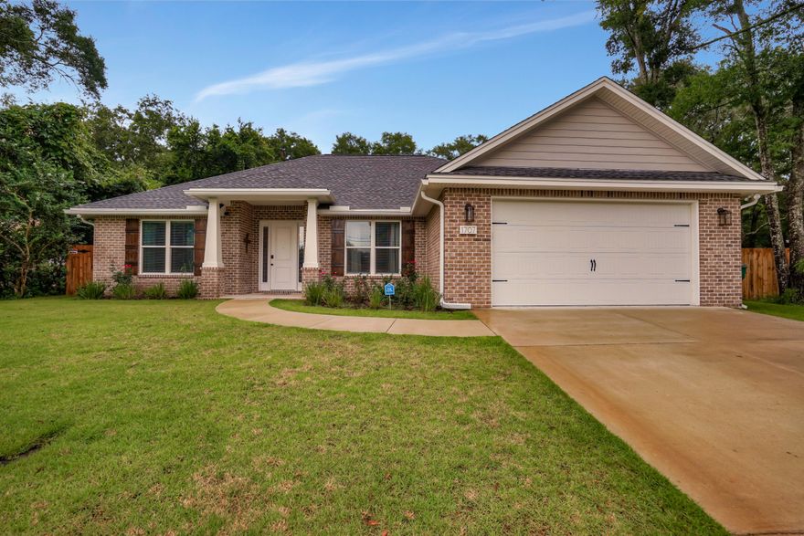 Gorgeous newly built 4 bedroom 2 bath home in the heart of Niceville. This home has a fantastic floor plan with no wasted space. Not a builder basic this home was upgraded to include wood look porcelain tile in master and all living areas, wood shelving throughout, light fixtures, stainless appliances and apron sink, crown molding throughout, custom faux wood blinds, custom stained wood shutters and seamless rain gutters. Large laundry mudroom has overhead cabinetry as well as  plenty below with granite countertops. The master bath suite has a freestanding soaking tub as well as a separate tiled shower. There is a detached 483 square foot garage/workshop out back that has power, new roof and new garage door. Don't miss your chance to live in this beautiful home, call for an appointment.