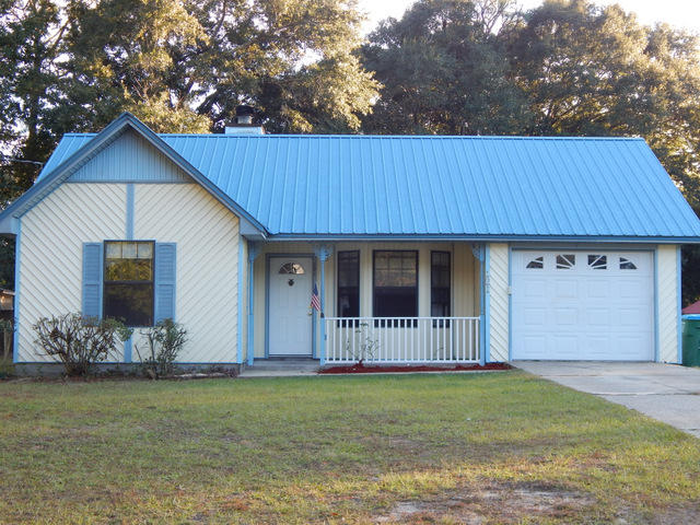 Very nice 3 bedroom 2 bath home set up in a split bedroom floor plan. The home is move in ready'' and clean. The home comes with a metal roof for easy care, vinyl siding, a wood burning fireplace and much more. The large concrete patio out back has interior access doors into the living room and also into the master bedroom. The one car garage is also heated and cooled through the central HVAC system. ( The actual home is 1160 square feet and the heated and cooled garage makes it 1347) The home is situated on a large corner lot that allows easy access for the RV, Boat, Camper or trailers. Come and take a close look at this great investment, starter or retirement type home before it is sold !